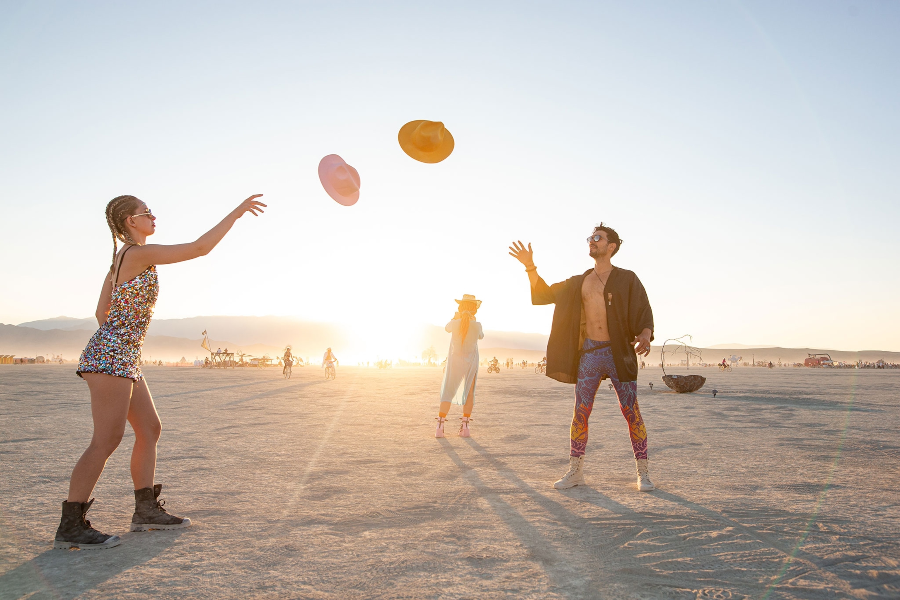 A grop of people playing with a ball.