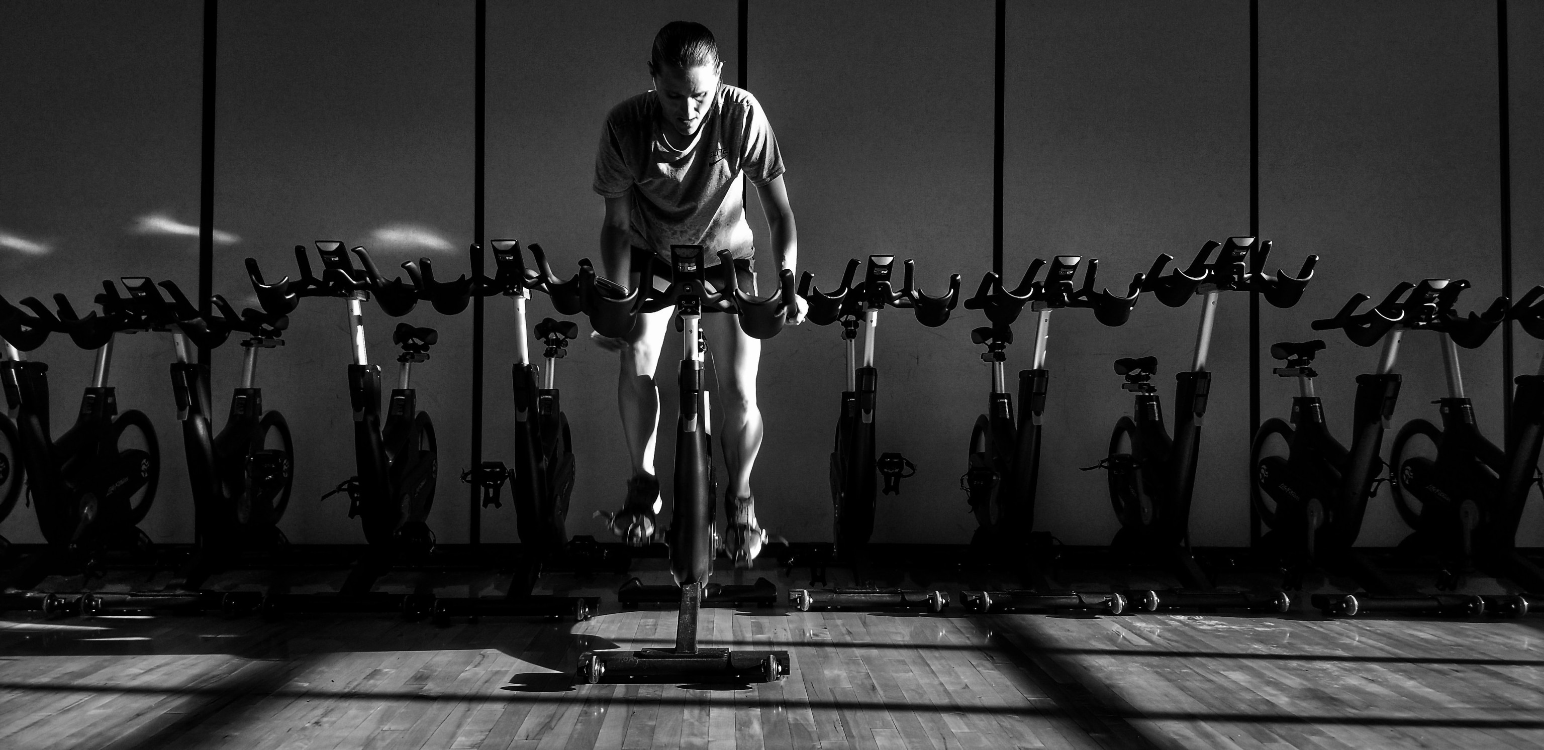 woman trains on indoor bike
