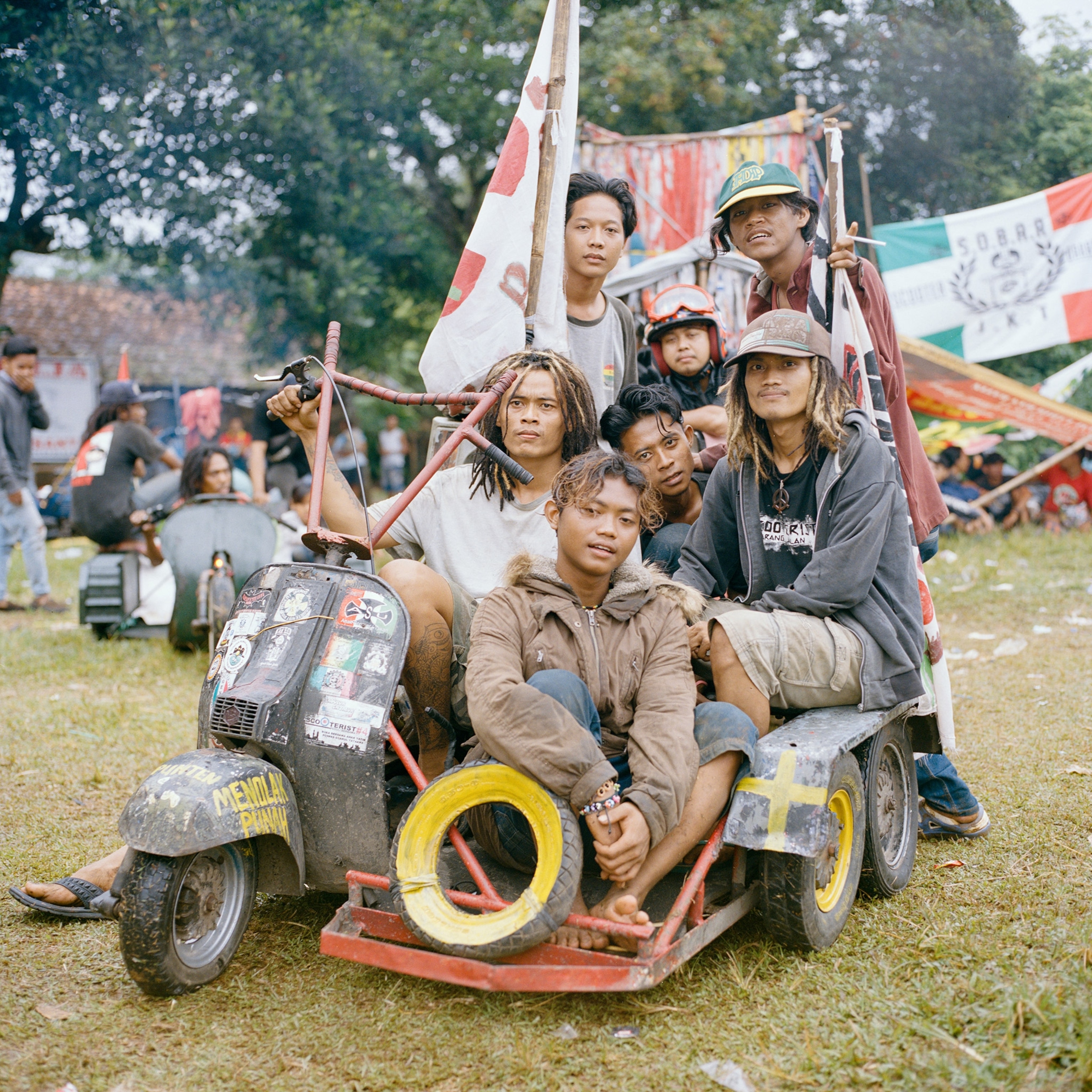 a scooter enthusiast and his friends at a vespa event in Indonesia