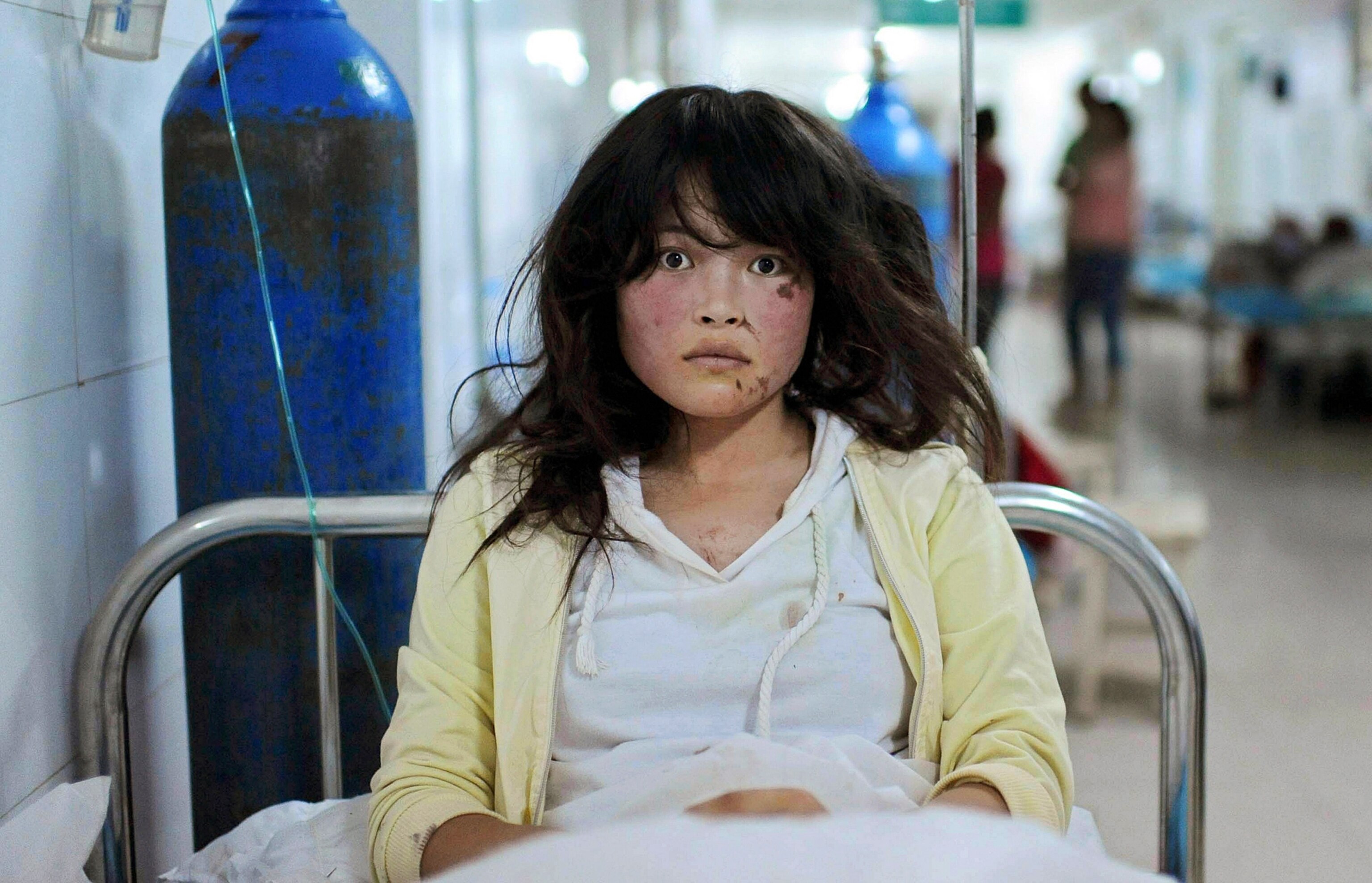 a survivor of the 2013 earthquake in Gansu Province, China.