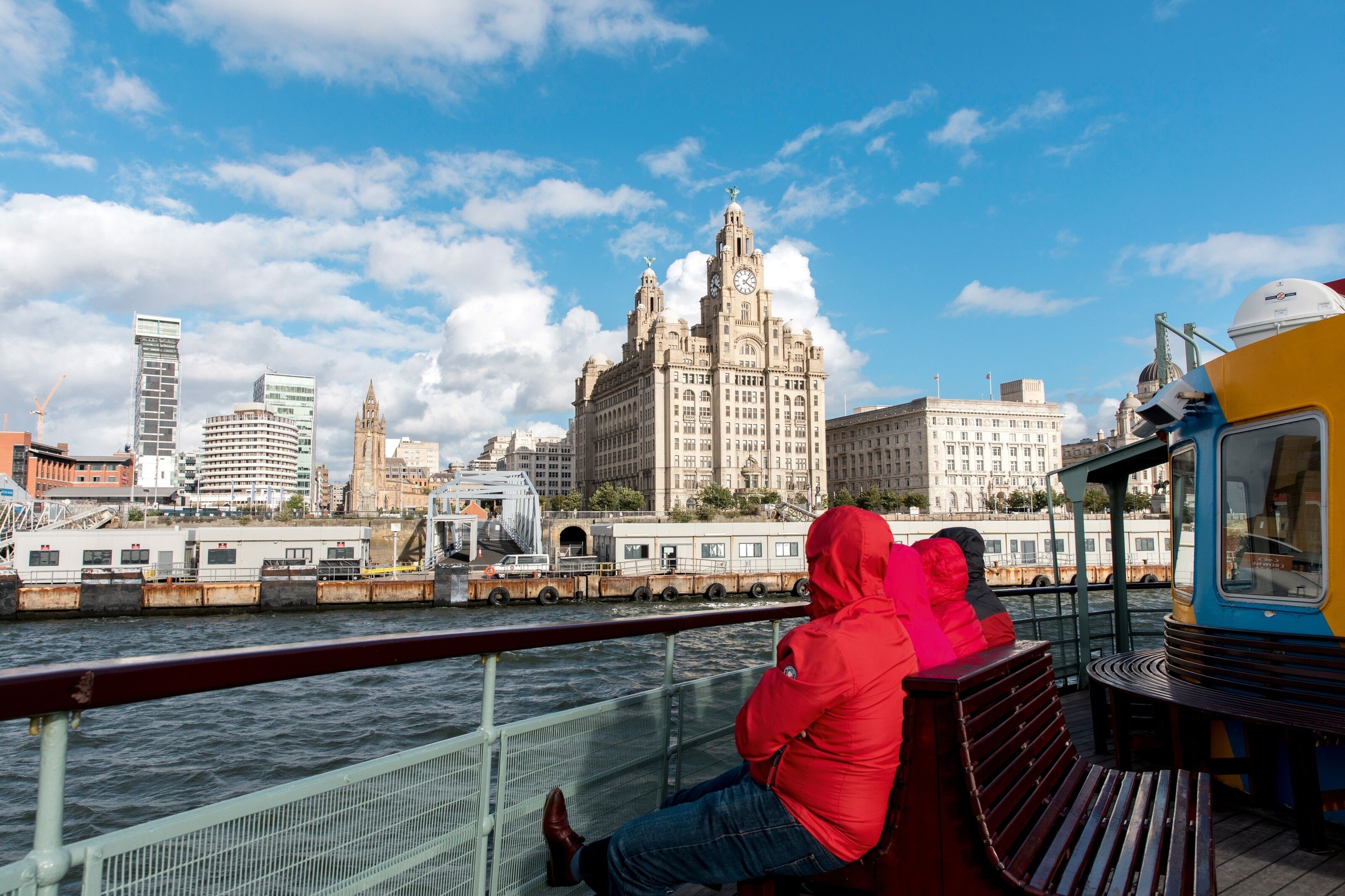 Ferry passing Liverpool Waterfront, overlooked by the Royal Liver Building.
