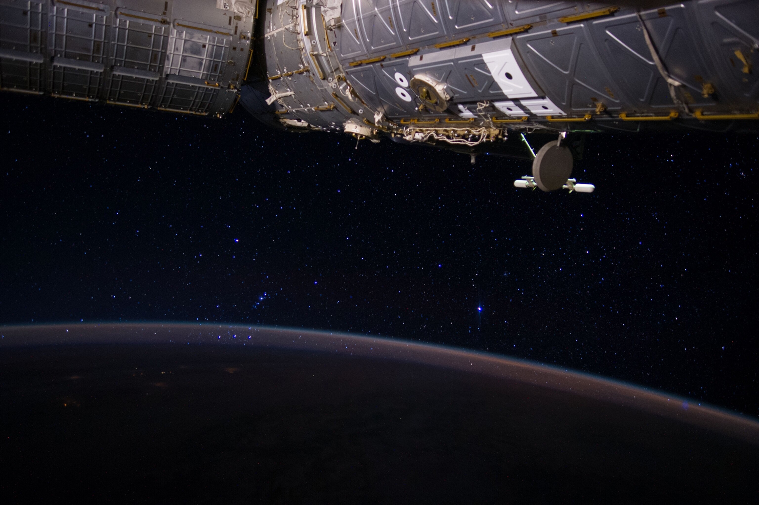 On June 23, 2014, Expedition 40 Flight Engineer Reid Wiseman captured this image which connects Earth to the International Space Station and to the stars.