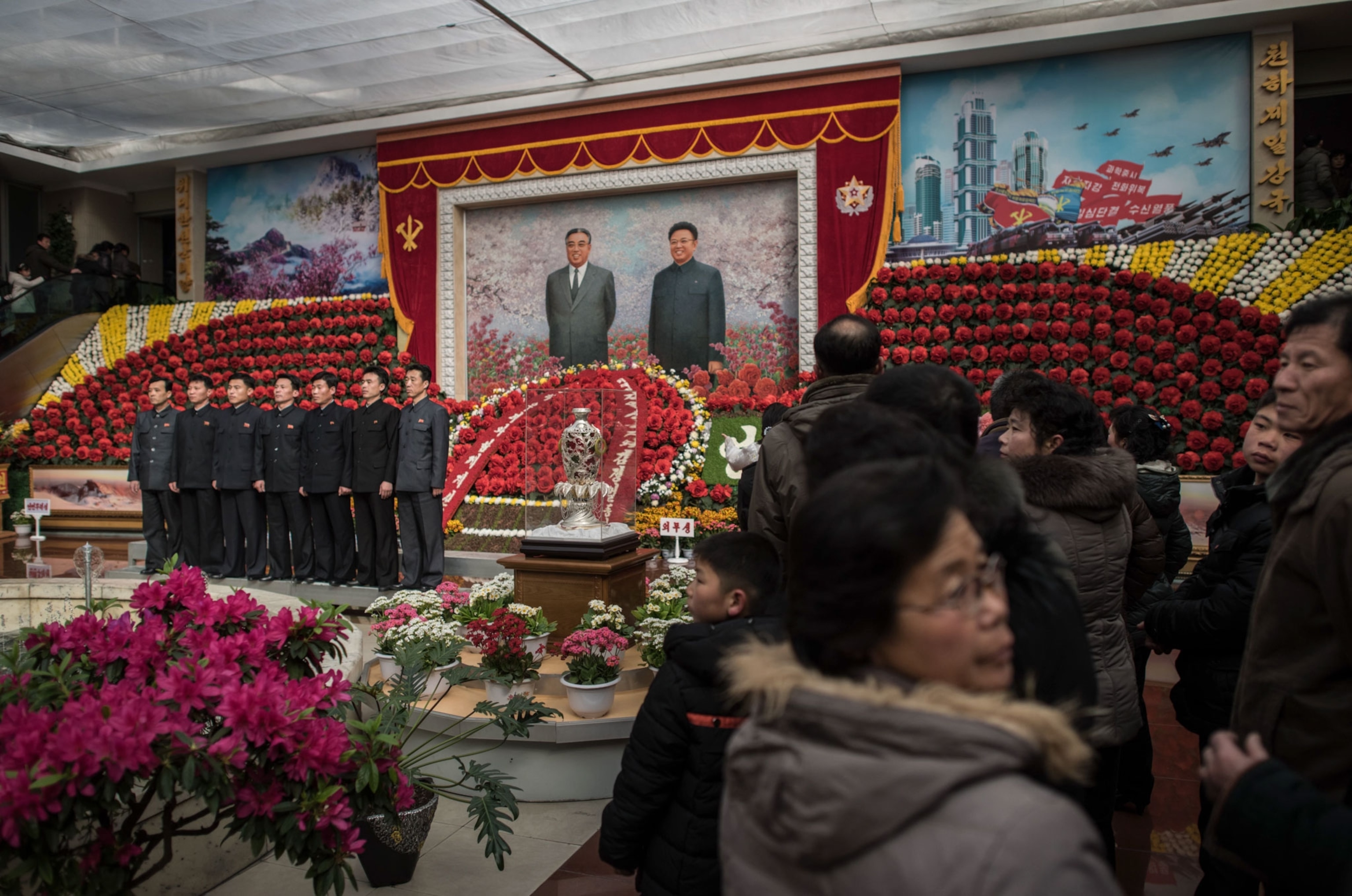 people at a flower show in North Korea