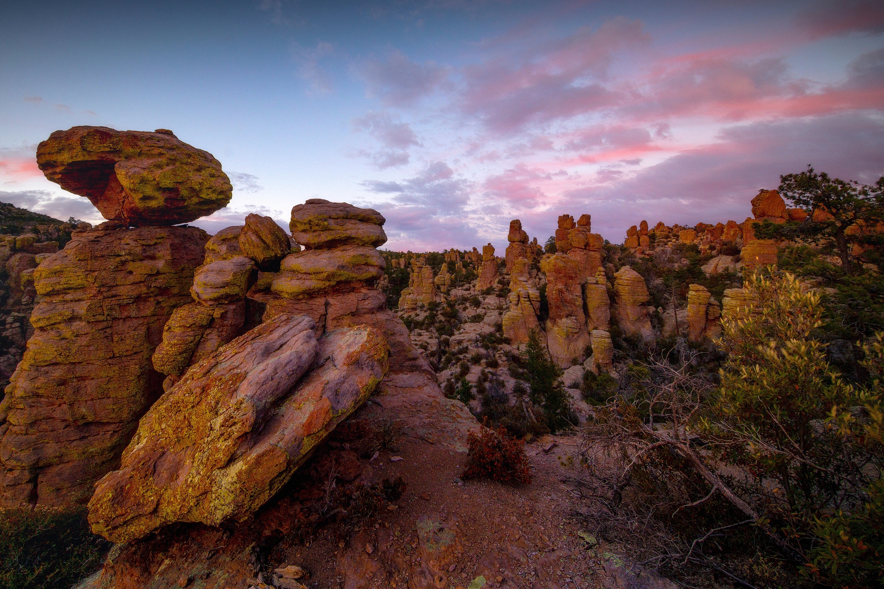 Towering, stacked rock formations at sunset