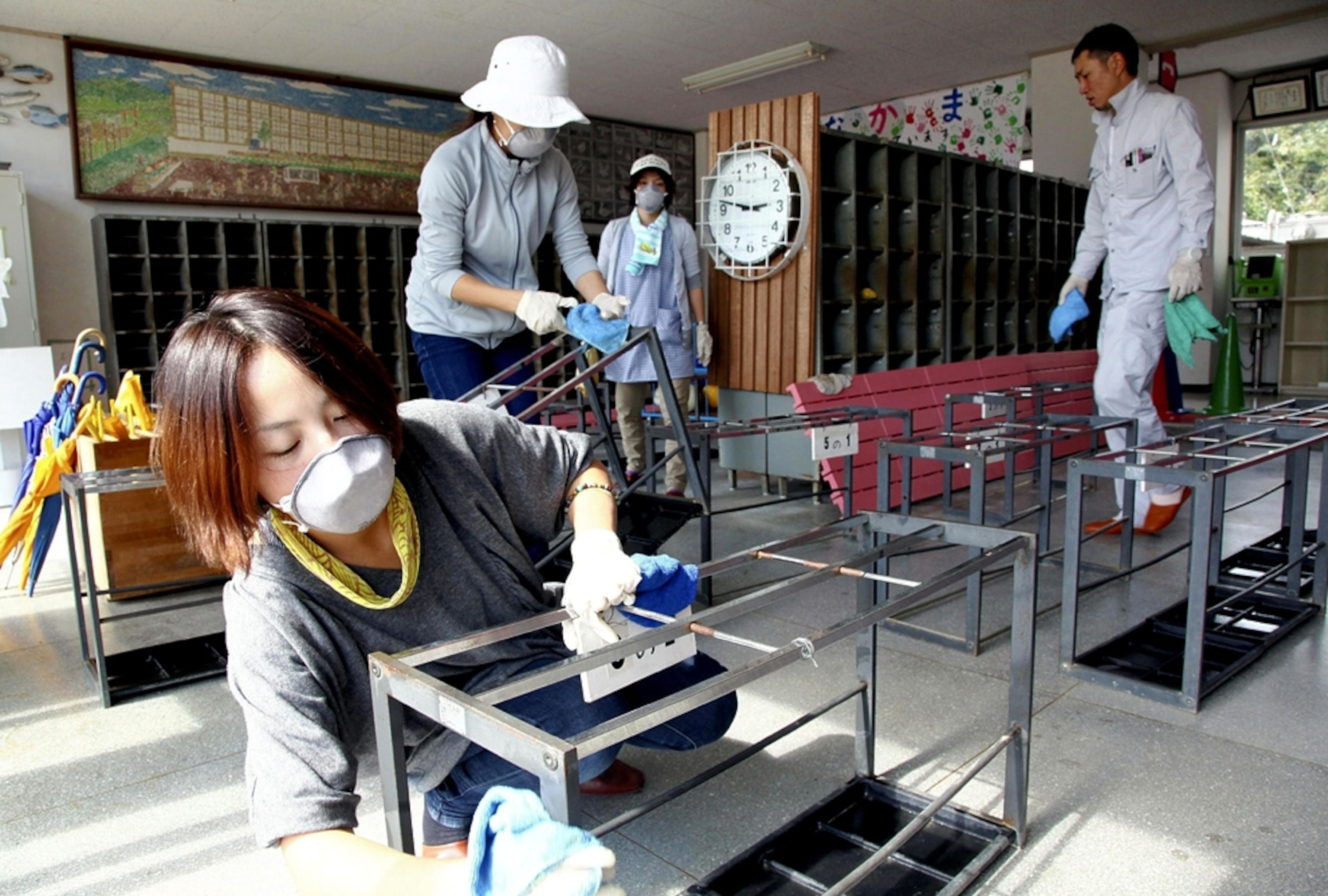 Teachers and parents work on decontamination at Omika Elementary School