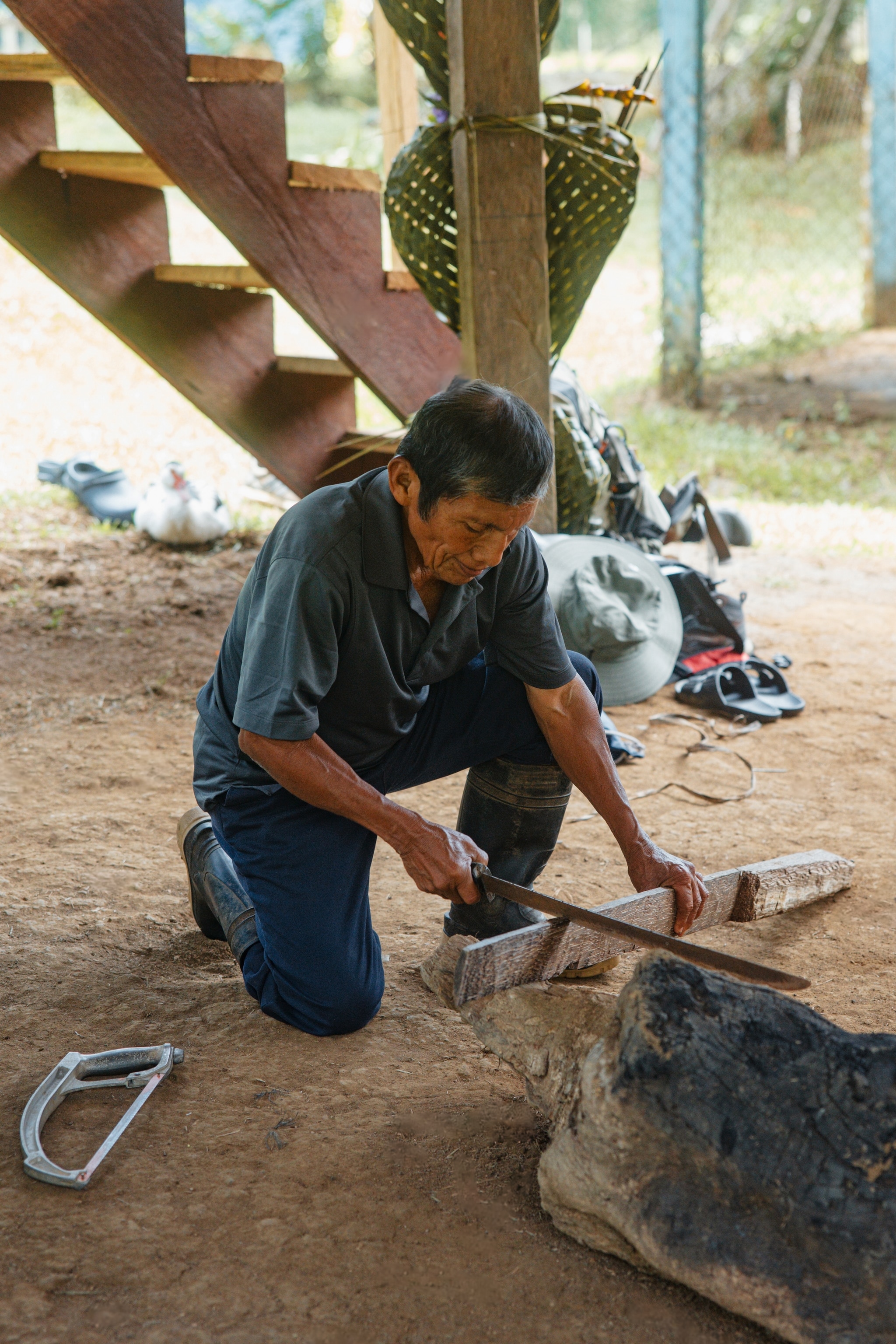 Man kneeling to do woodwork