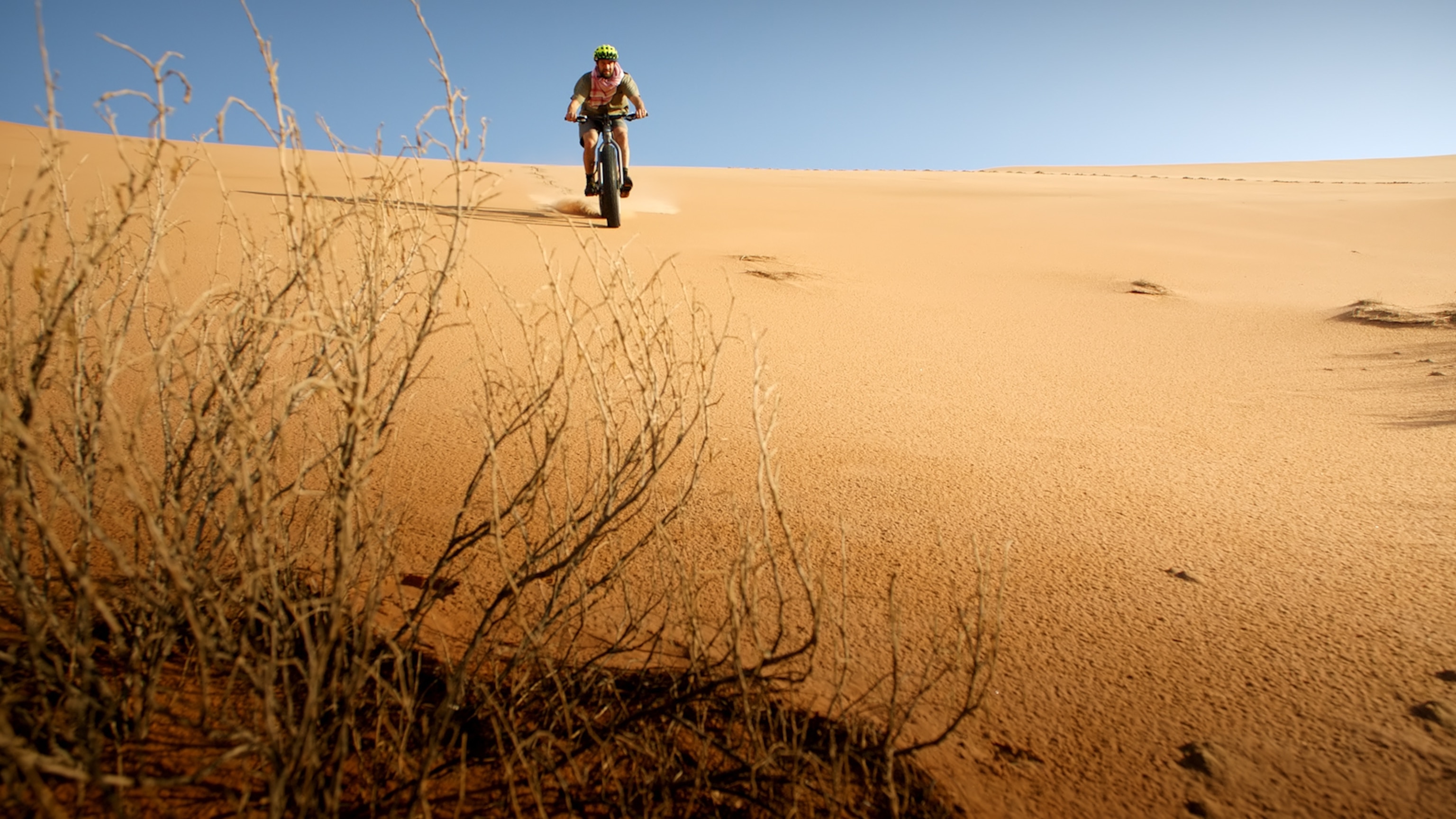 Renan Ozturk on a fat-tire bike in Empty Quarter