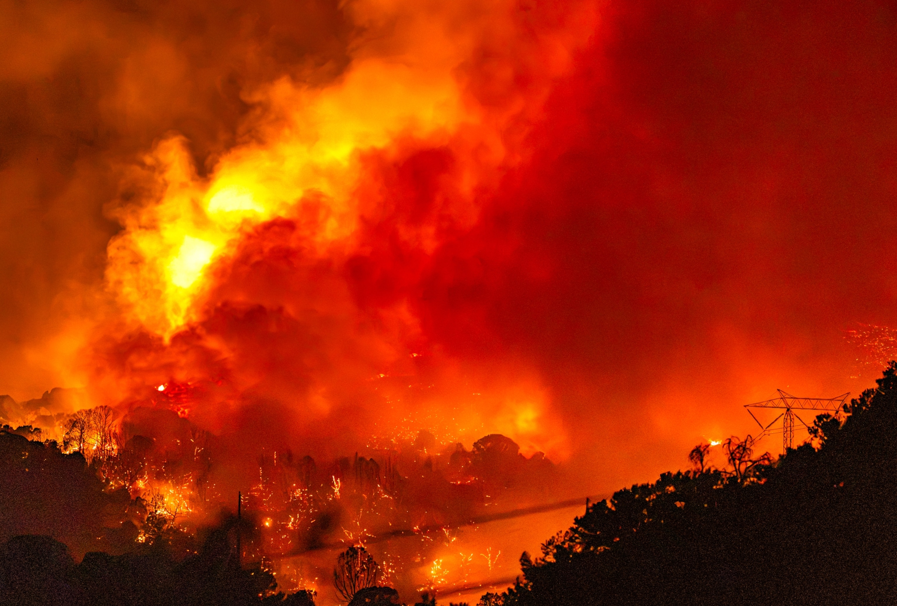 Large flames burn on a hillside in the Lake Christine Fire in Basalt, Colorado.