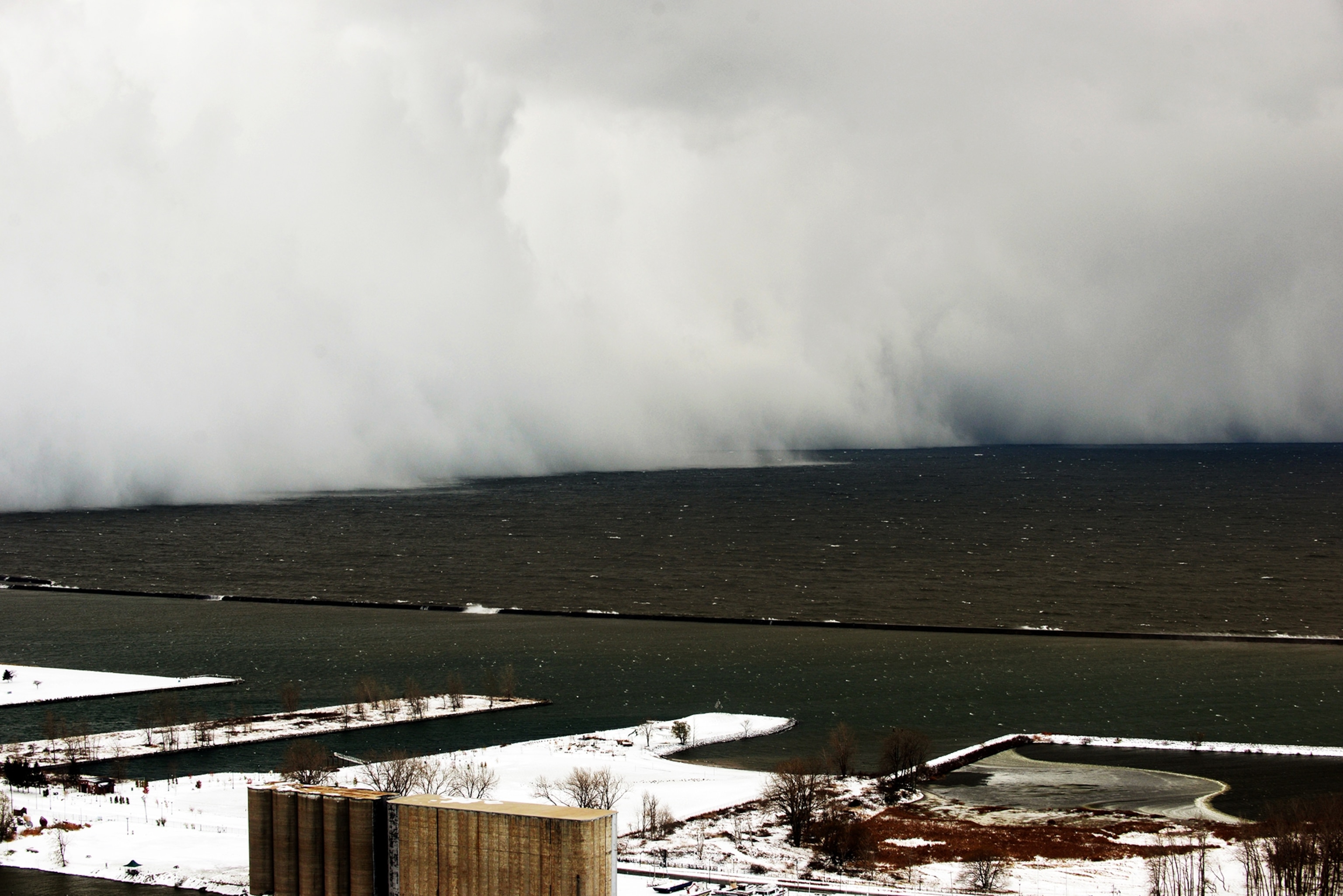 A house is obscured by wind-blown, lake-effect snow on Tuesday, Nov. 18, 2014 in Buffalo, N.Y. Parts of New York measured the season's first big snowfall in feet, rather than inches, as 3 feet of lake-effect snow blanketed the Buffalo area.