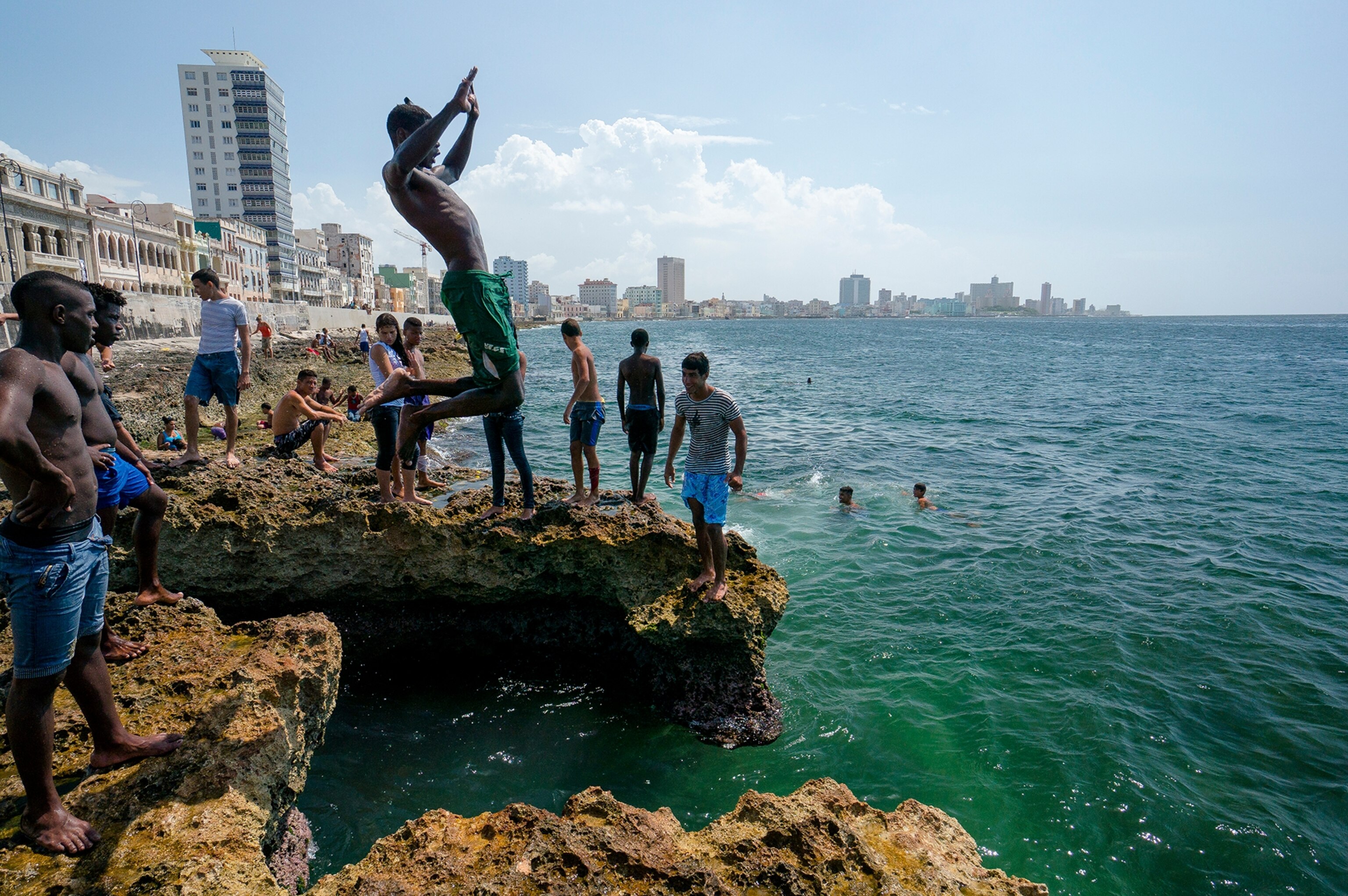 teens jumping into ocean, Cuba