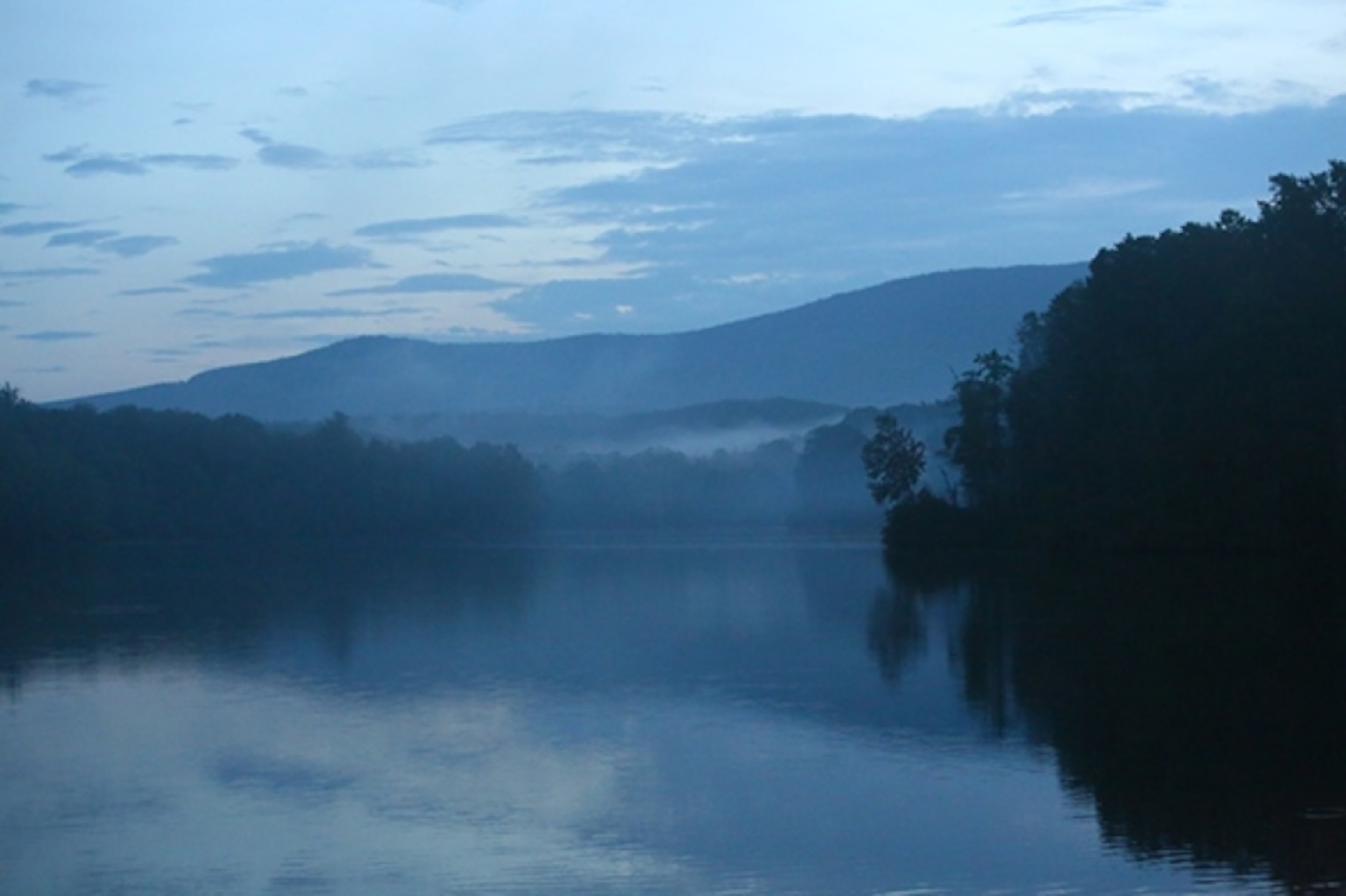 The beauty of the Blue Ridge reflected in one of the area's many lakes (Photograph by Rob Langhammer)