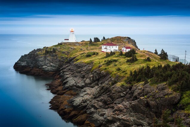 A span of rock with a lighthouse by the water in New Brunswick