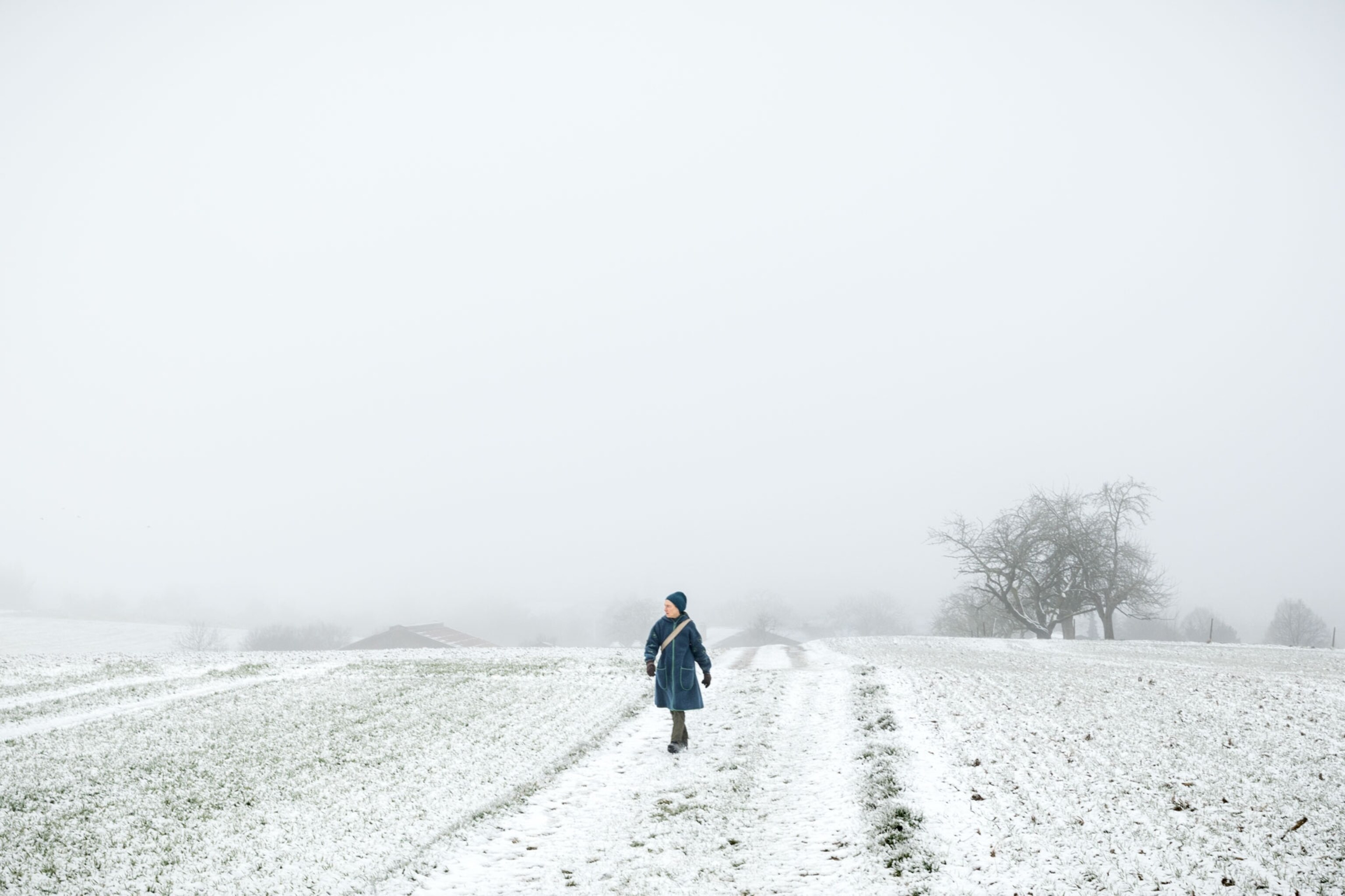 a person walking through the snow