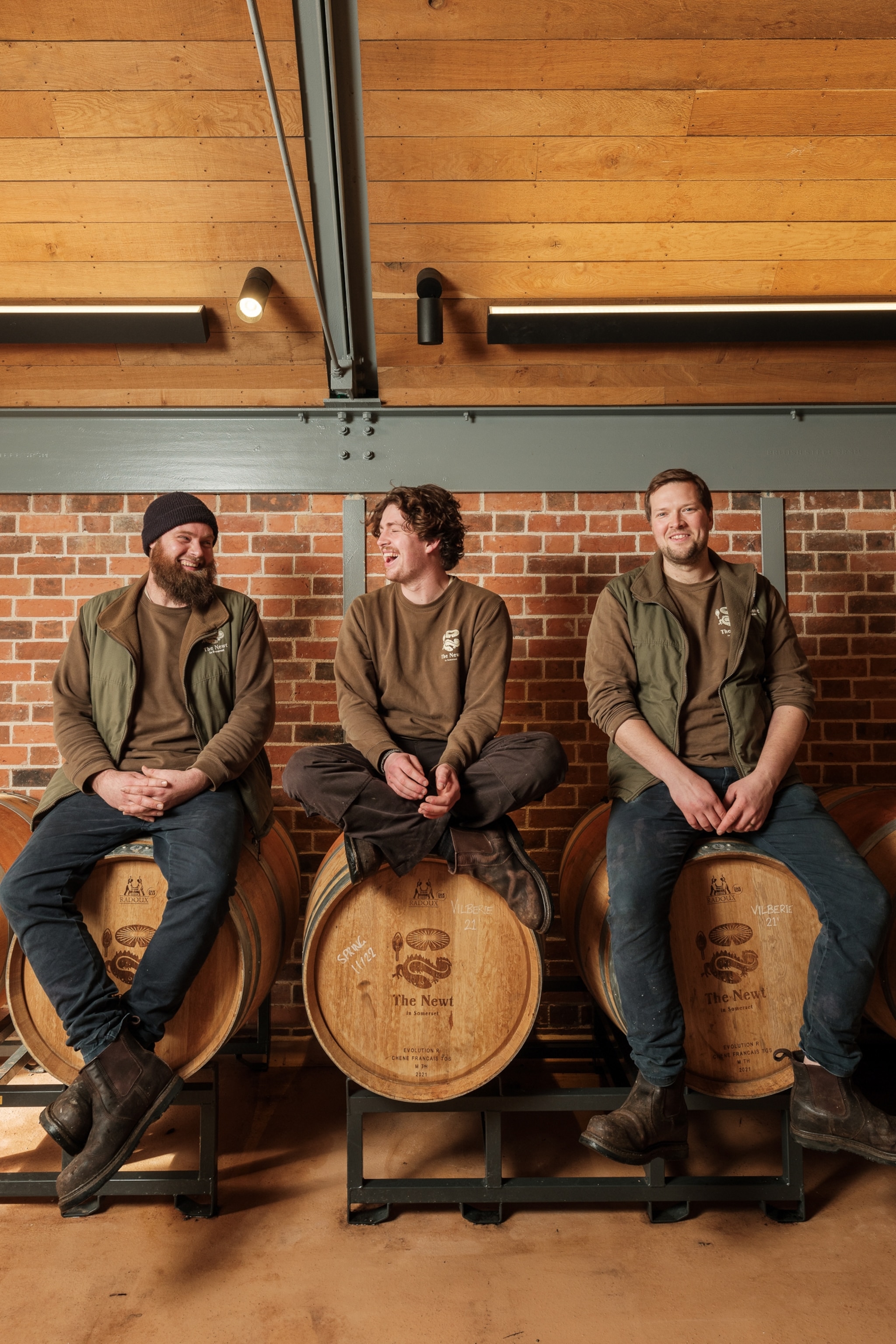 Three men sat on barrels