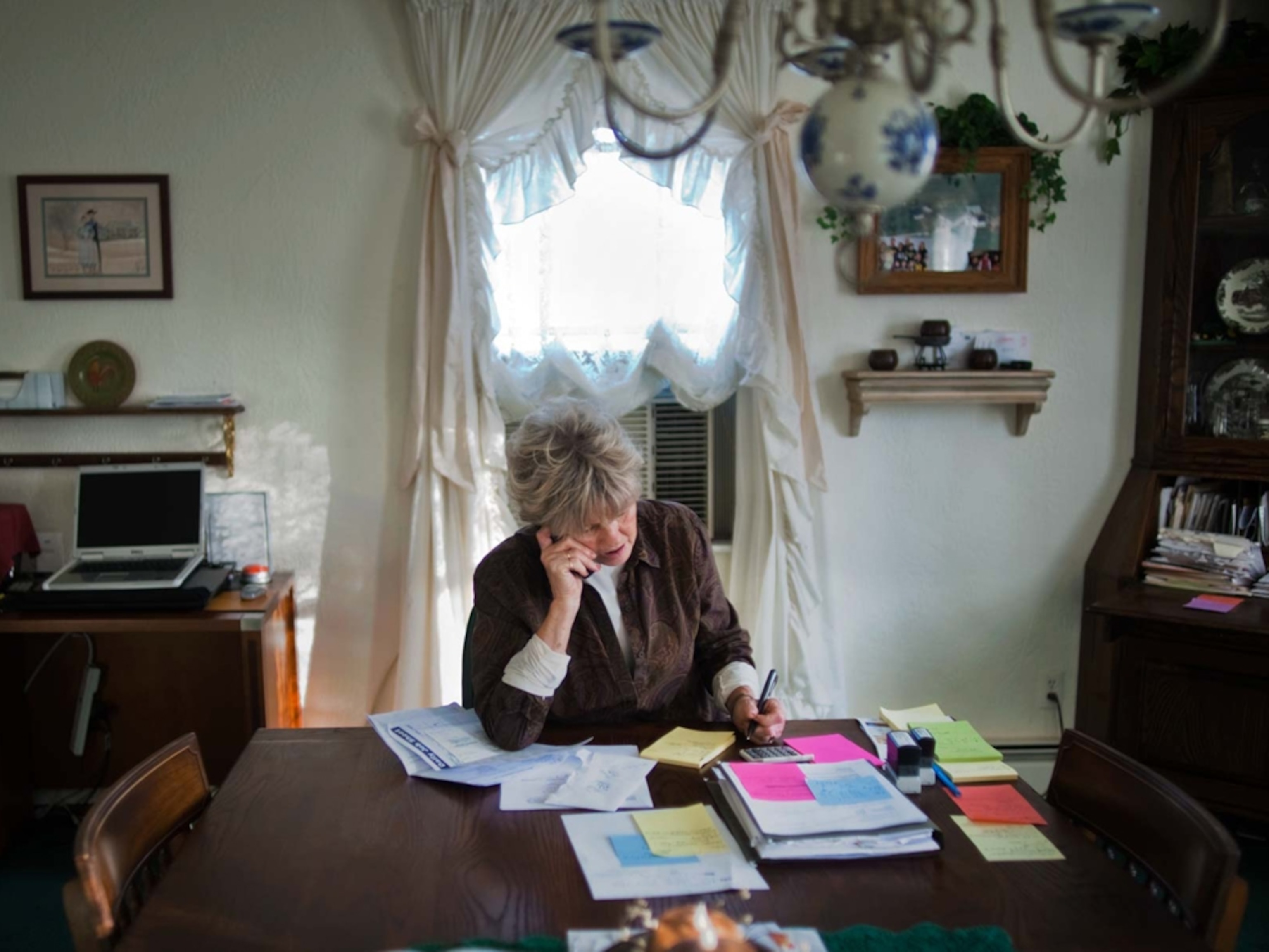 Beverly Romanetti works at the dining room table of her home in Hickory, Pennsylvania. She uses the table as her office, to keep track of the family's business servicing the gas companies. The Romanettis also have leased their land to a drilling firm.