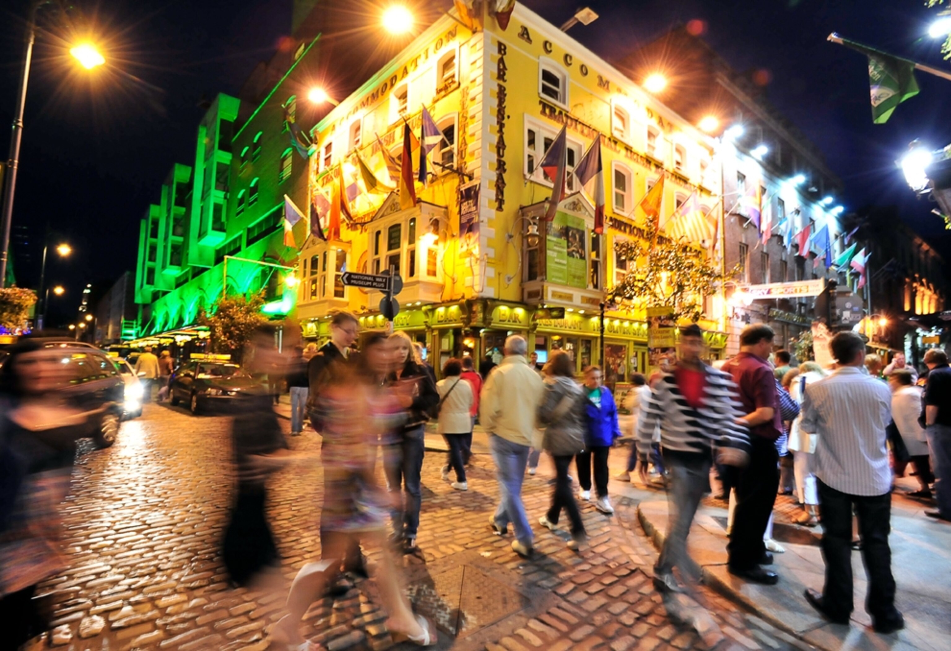 Young people crowd the streets at night in downtown Dublin Ireland
