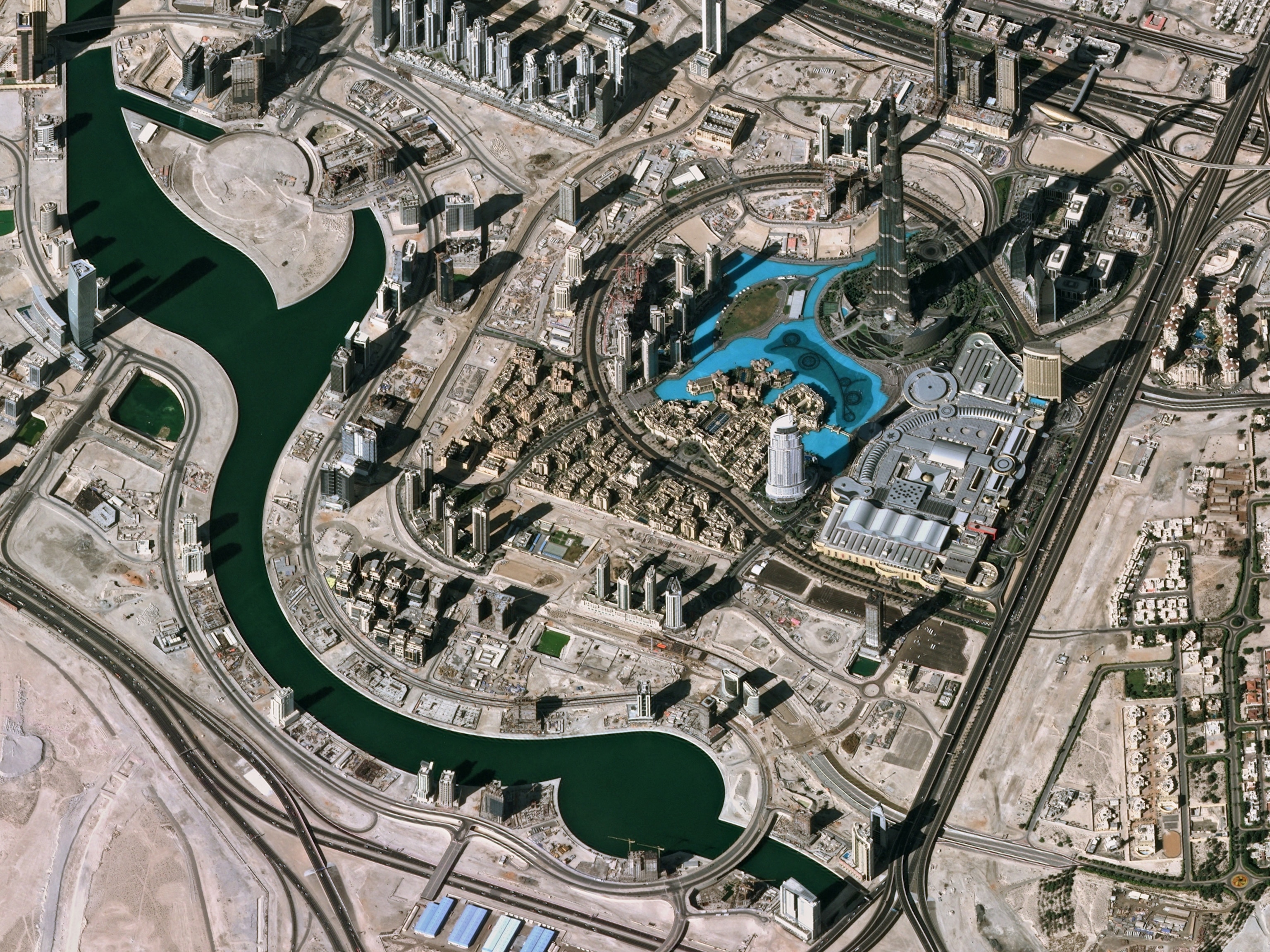 a satellite picture of the Burj Khalifa and a lake in Dubai