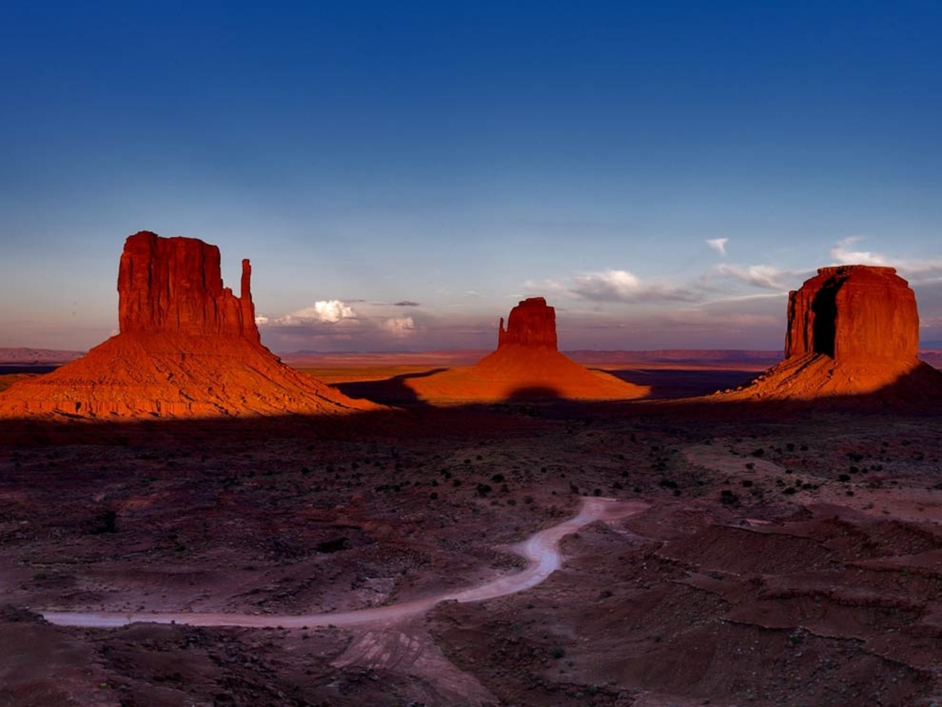 Sun setting on huge red rock formations