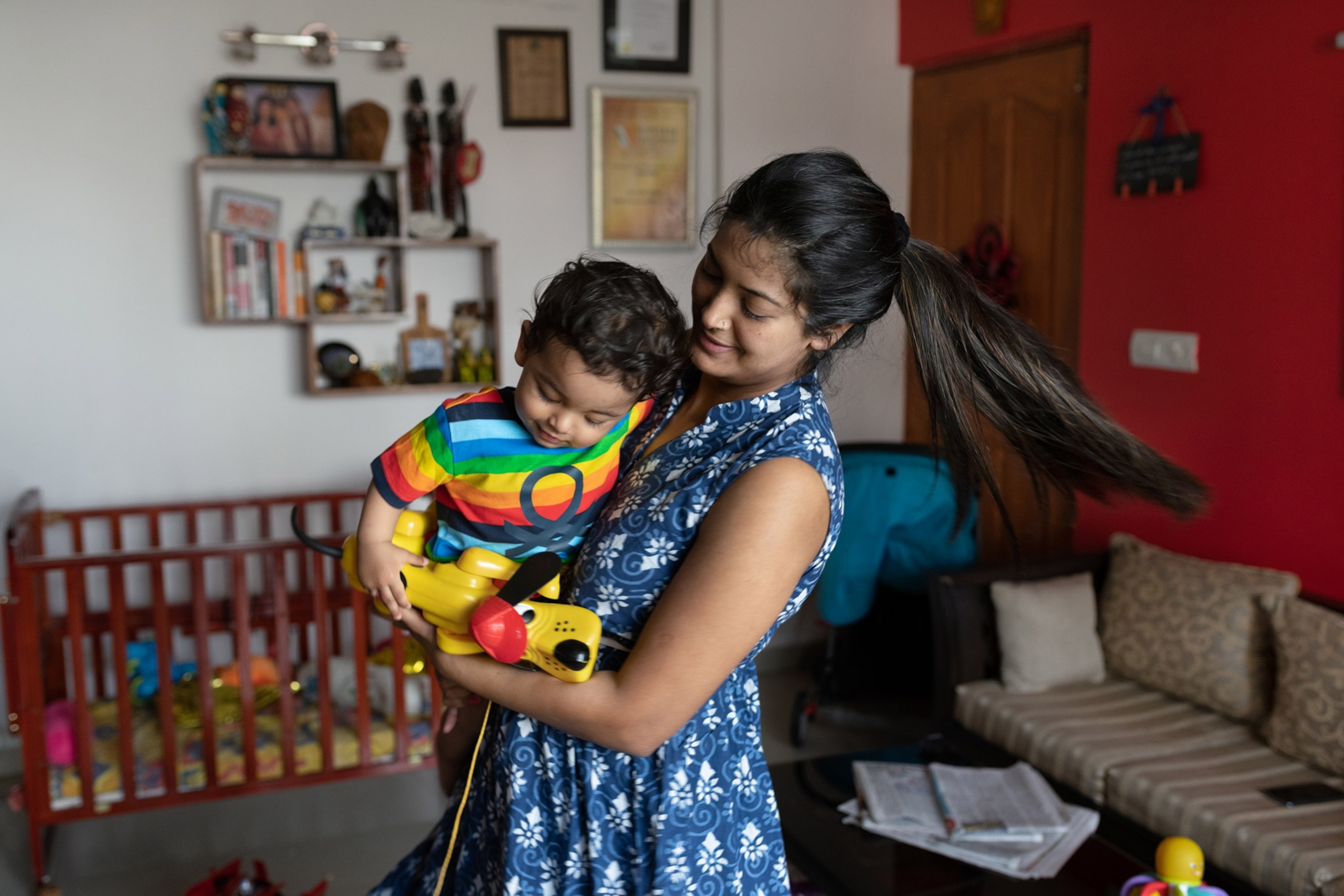 a mother holding her son in her arms