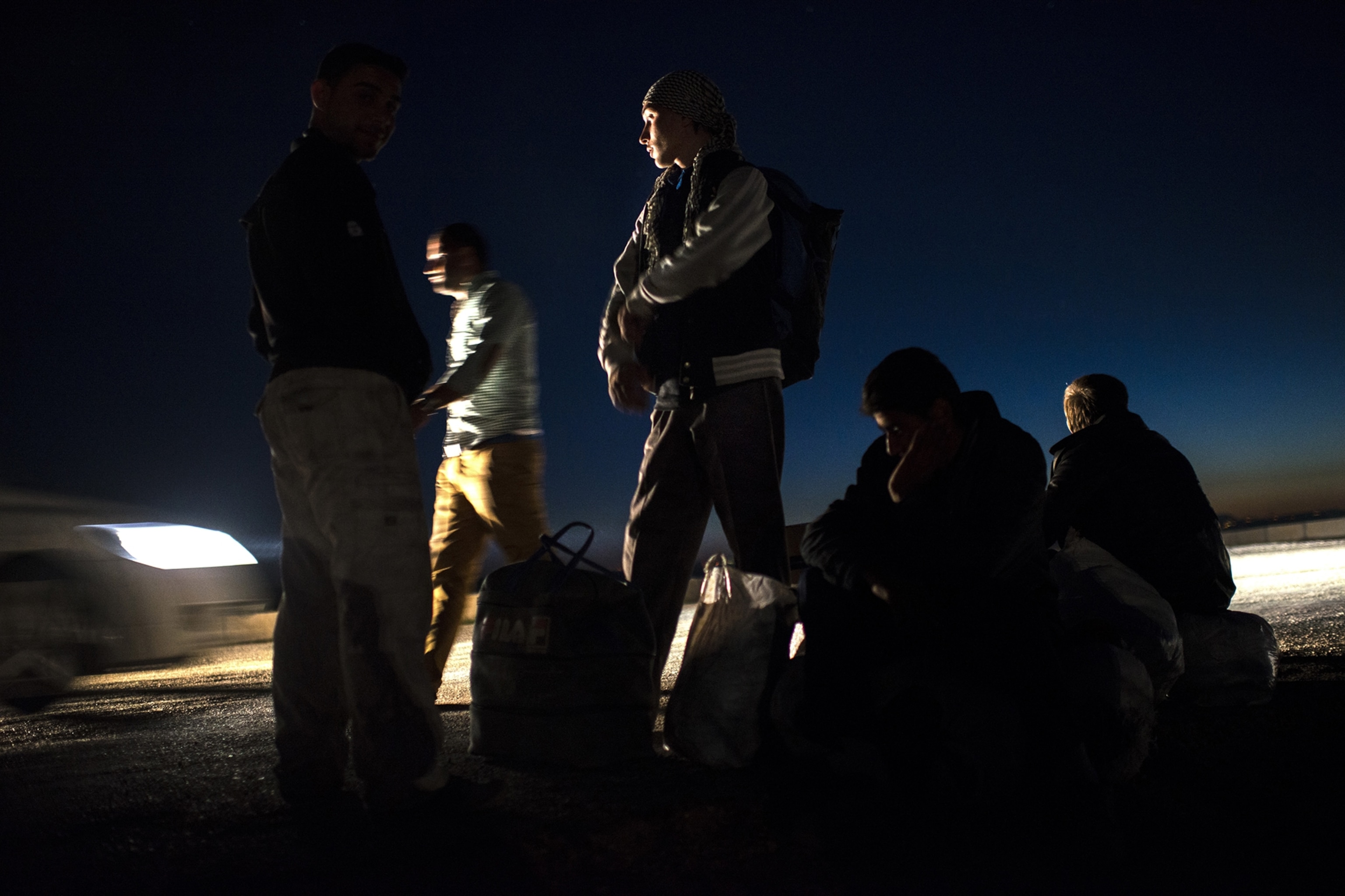 Syrian refugees cross into Turkey after the Muslim Holiday of Eid al-Adha through unofficial border crossings in villages around Reyhanli and Hacipasa in Turkey, October 20, 2013.