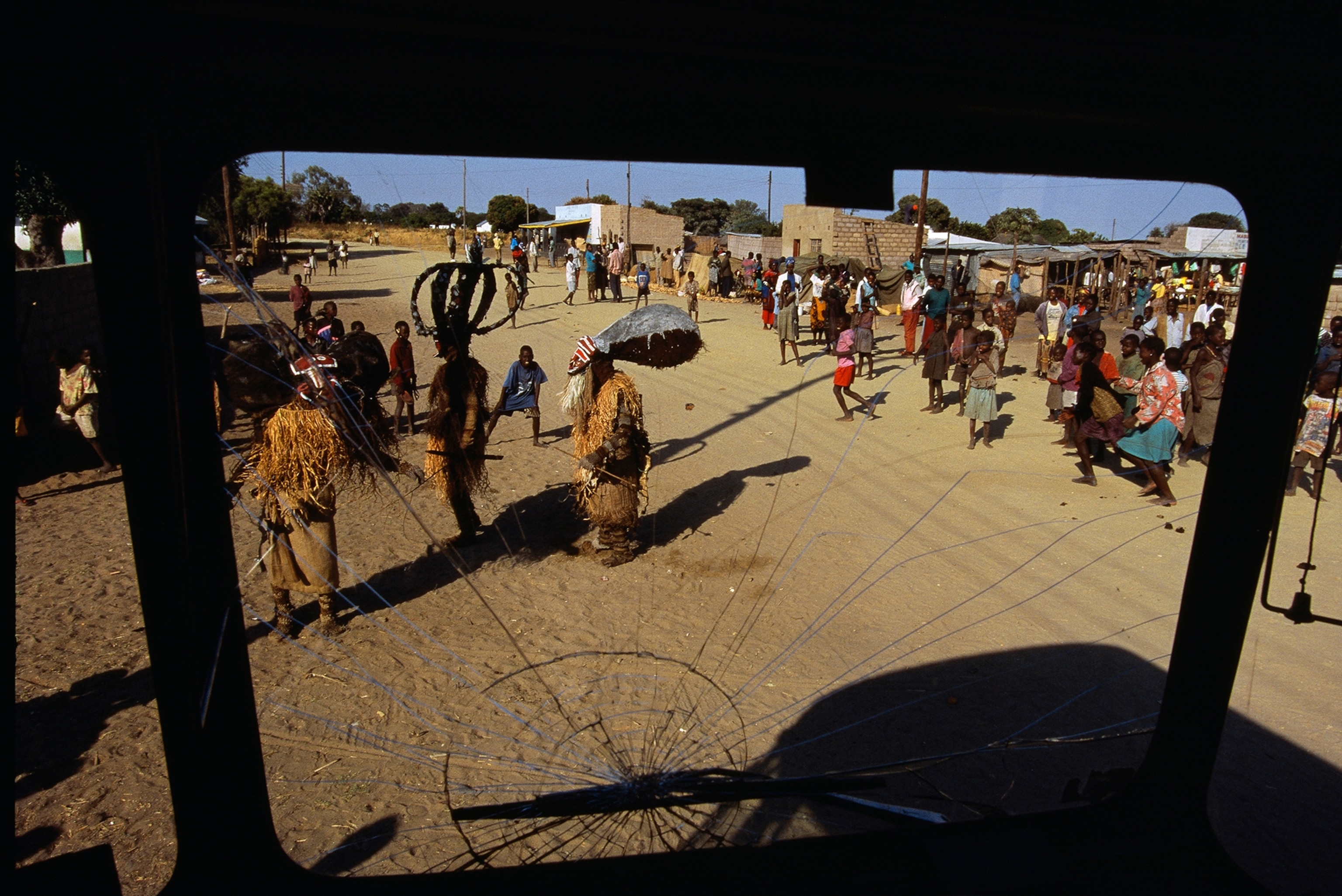 Makishi dancers liven up market day in Lukulu.