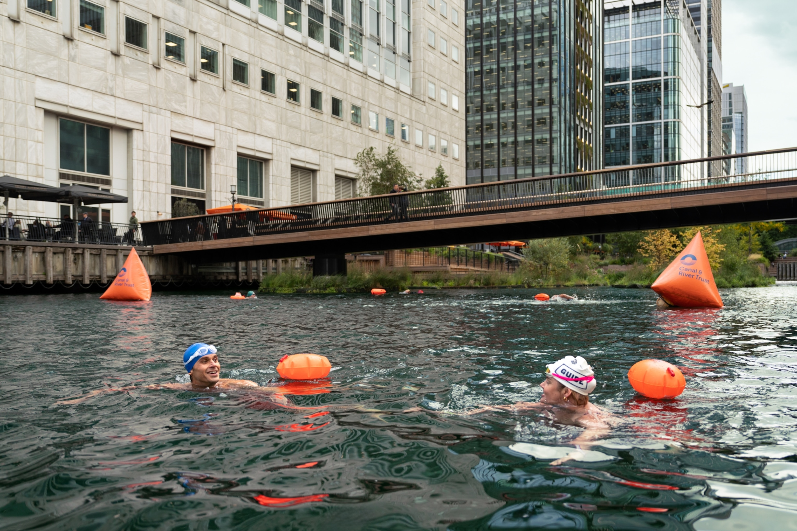Antoni and Francesca take a cold swim at Canary Wharf, in the heart of London's financial district.
