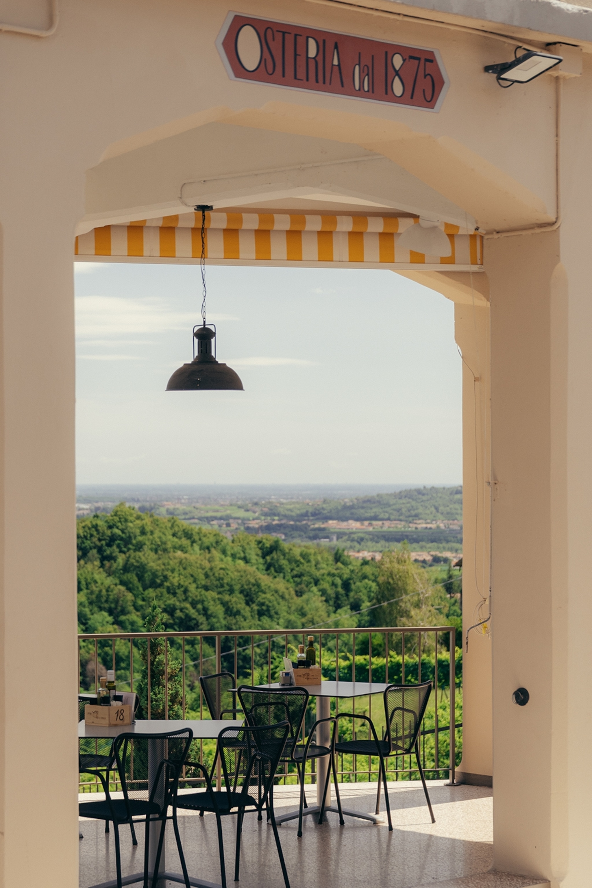 A restaurant terrace with open view over a hill
