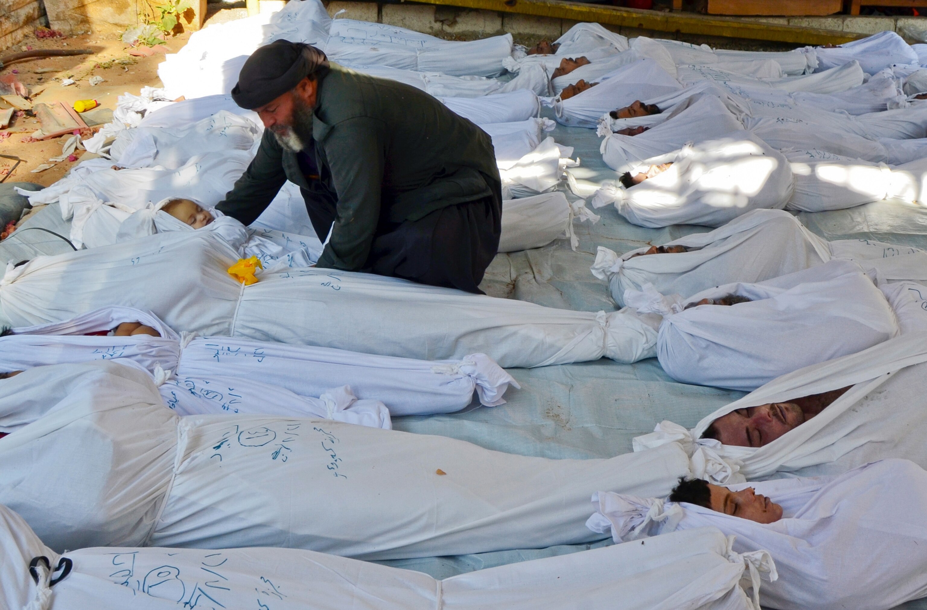 nerve gas victims in body bags in Syria.
