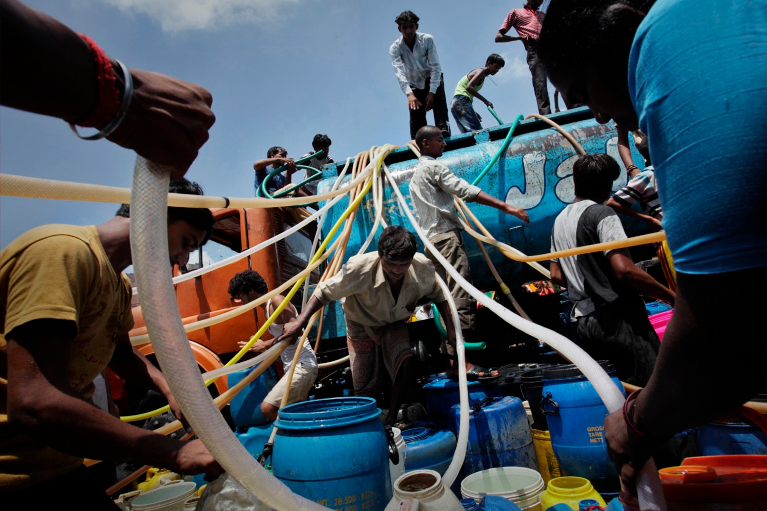 Getting water is a daily challenge at the Nehru settlement camp near New Delhi, India, as seen in 2009.