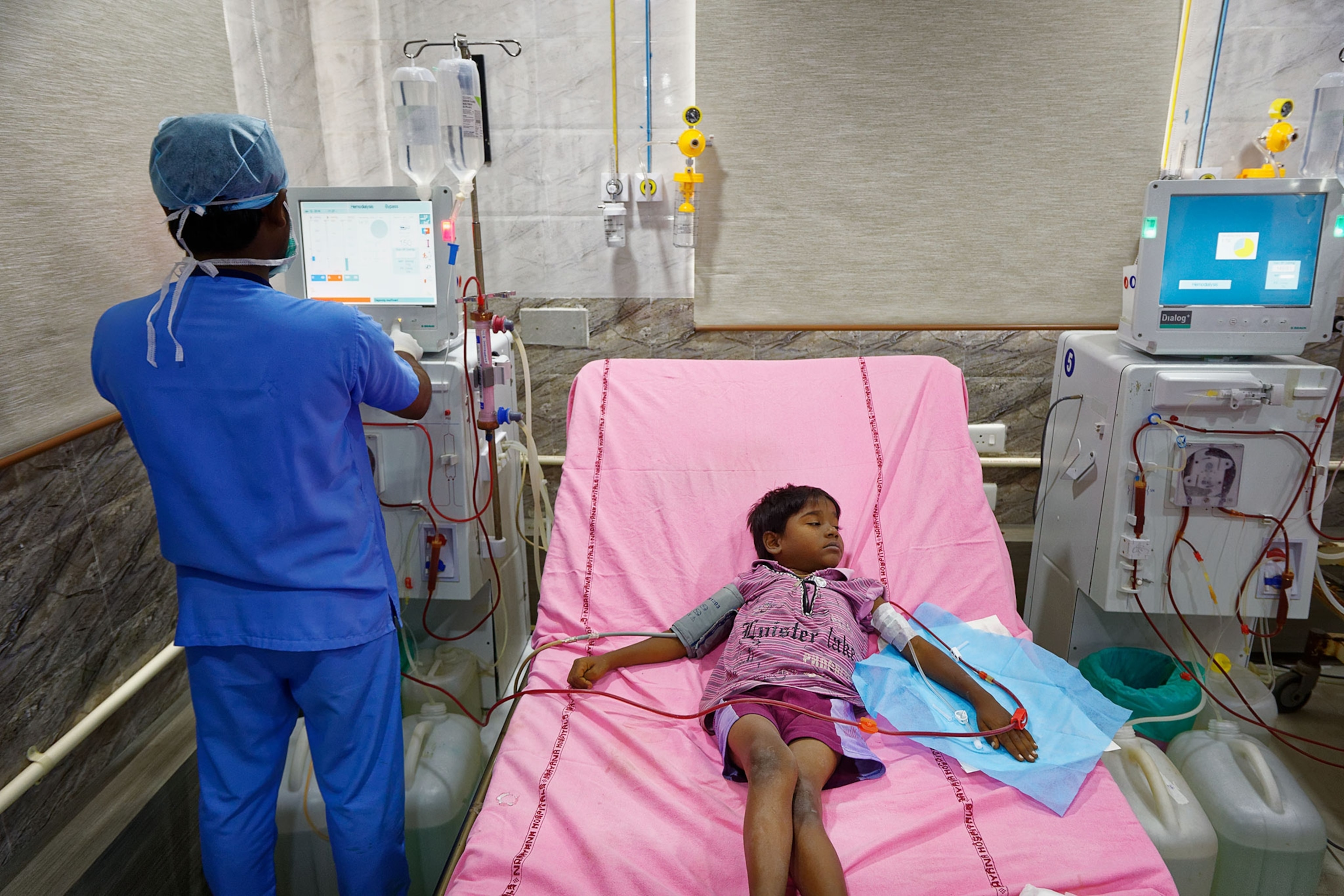 a child in a hospital bed