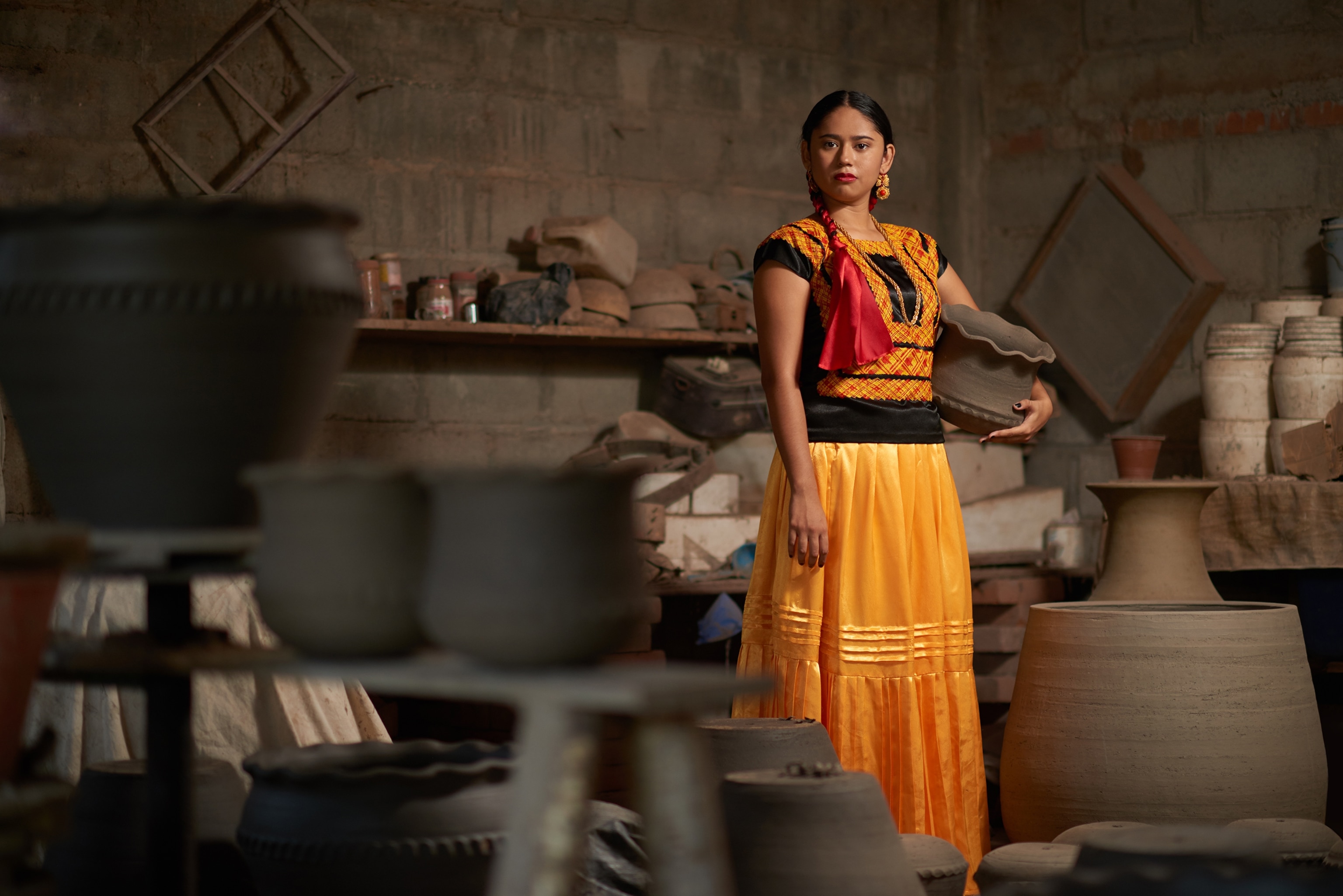 a isthmus woman holding a clay pot in Ixtaltepec, Oaxaca, Mexico