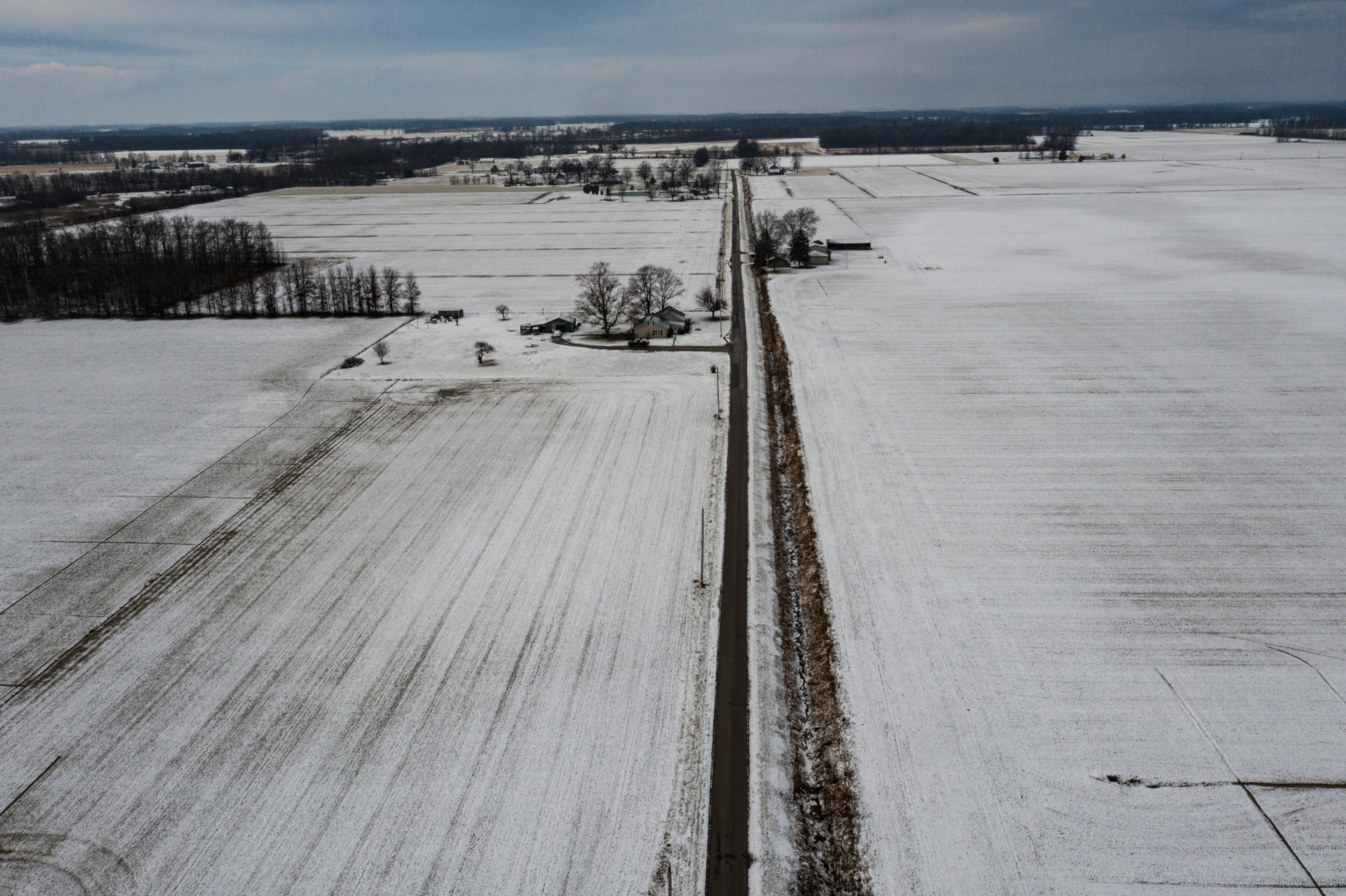 A road running through snowy land