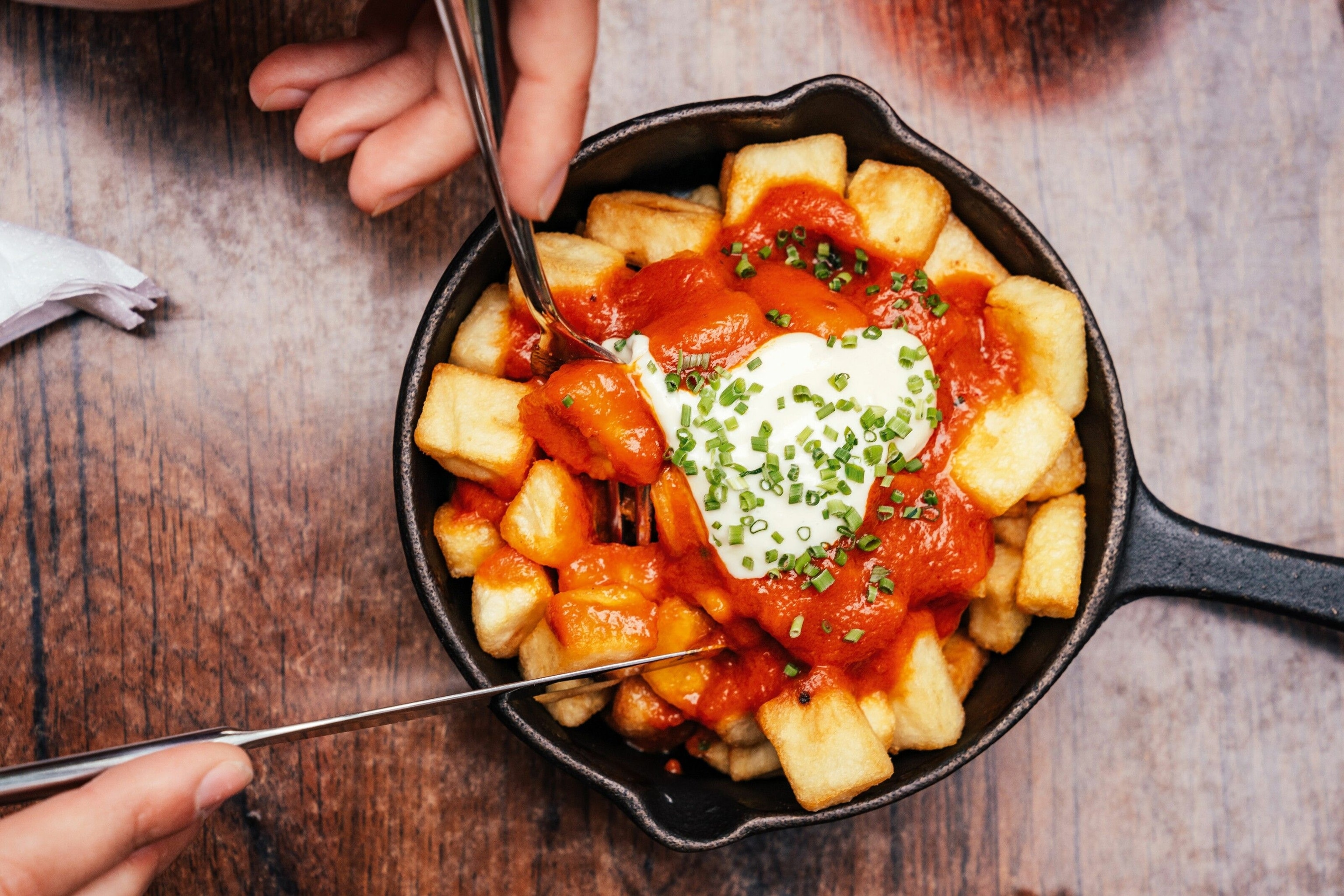 A classic patatas bravas at Camino in King's Cross, London.