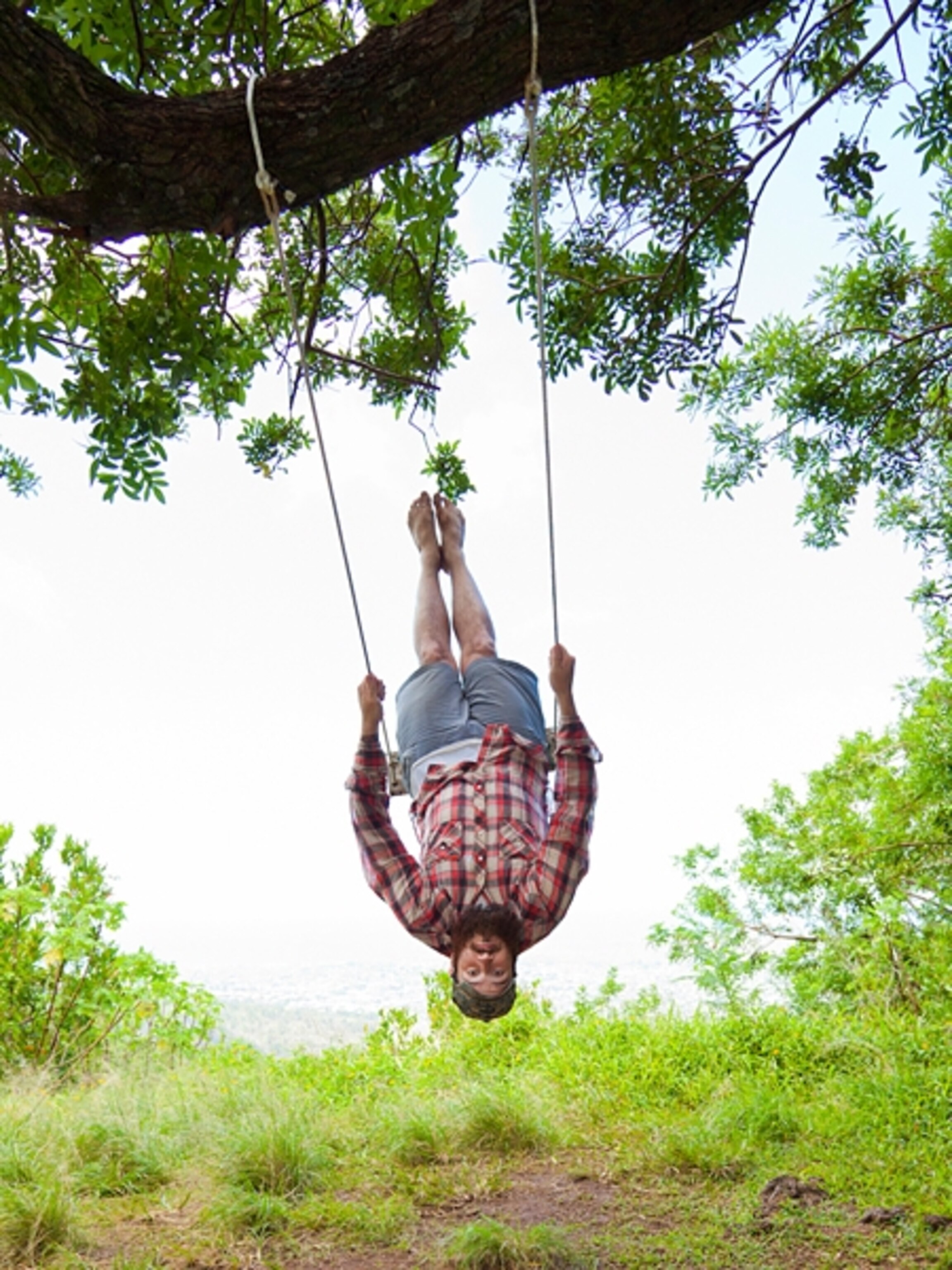 Theron Humphrey swinging in a tree