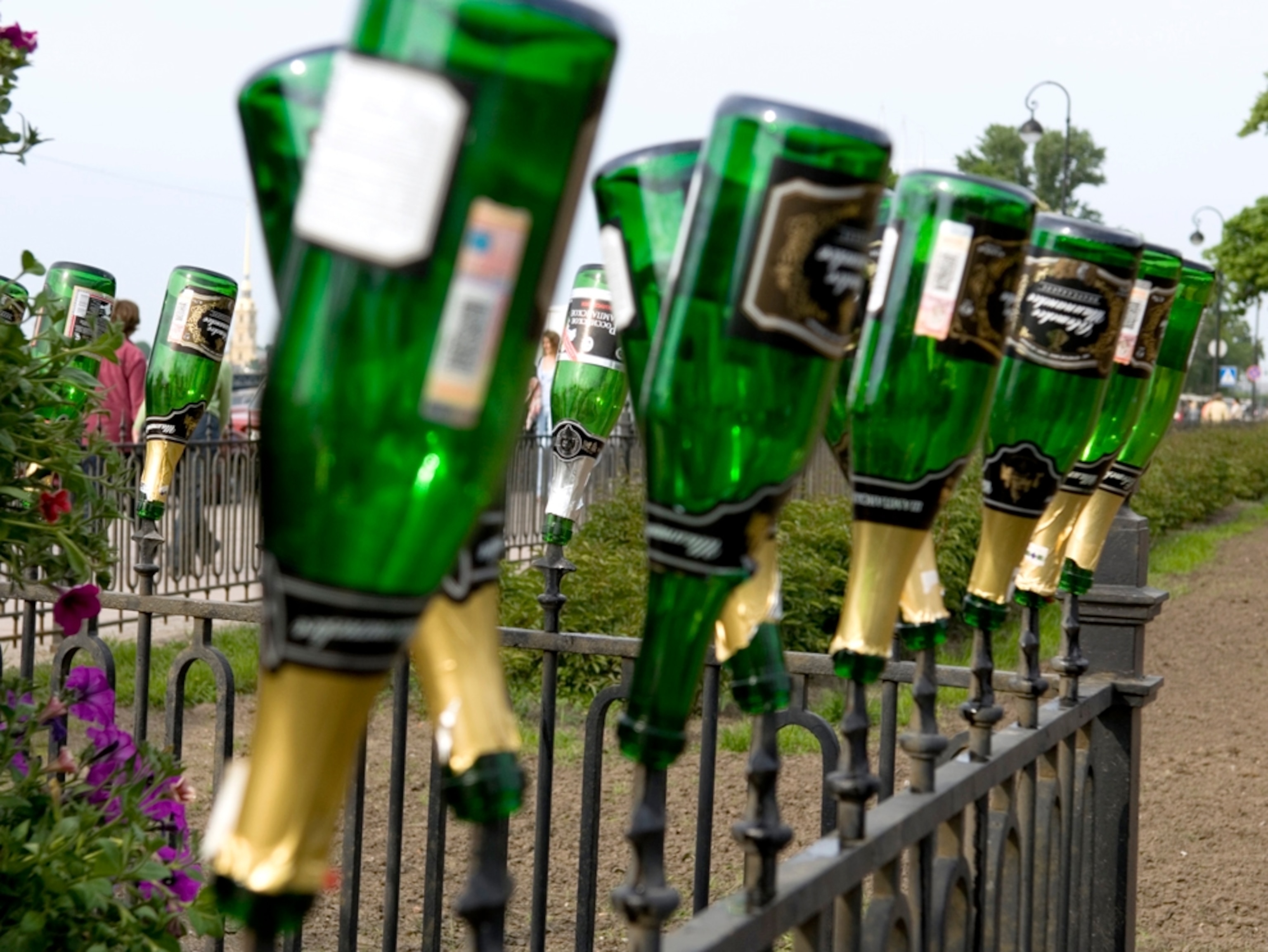 Iron fence with champagne bottles