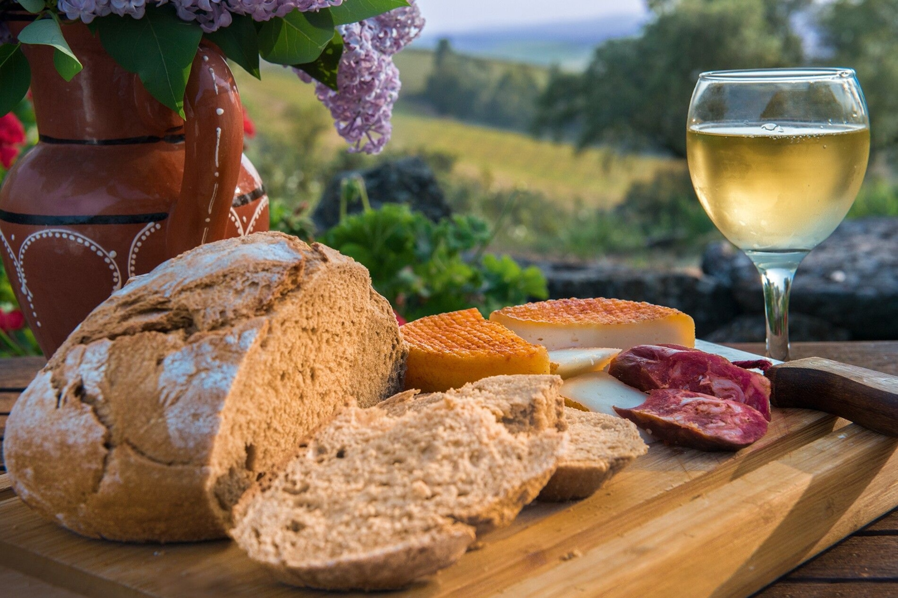 Some traditional Portuguese fare of Vino Verdi (young white wine), cheese, sausage and bread.