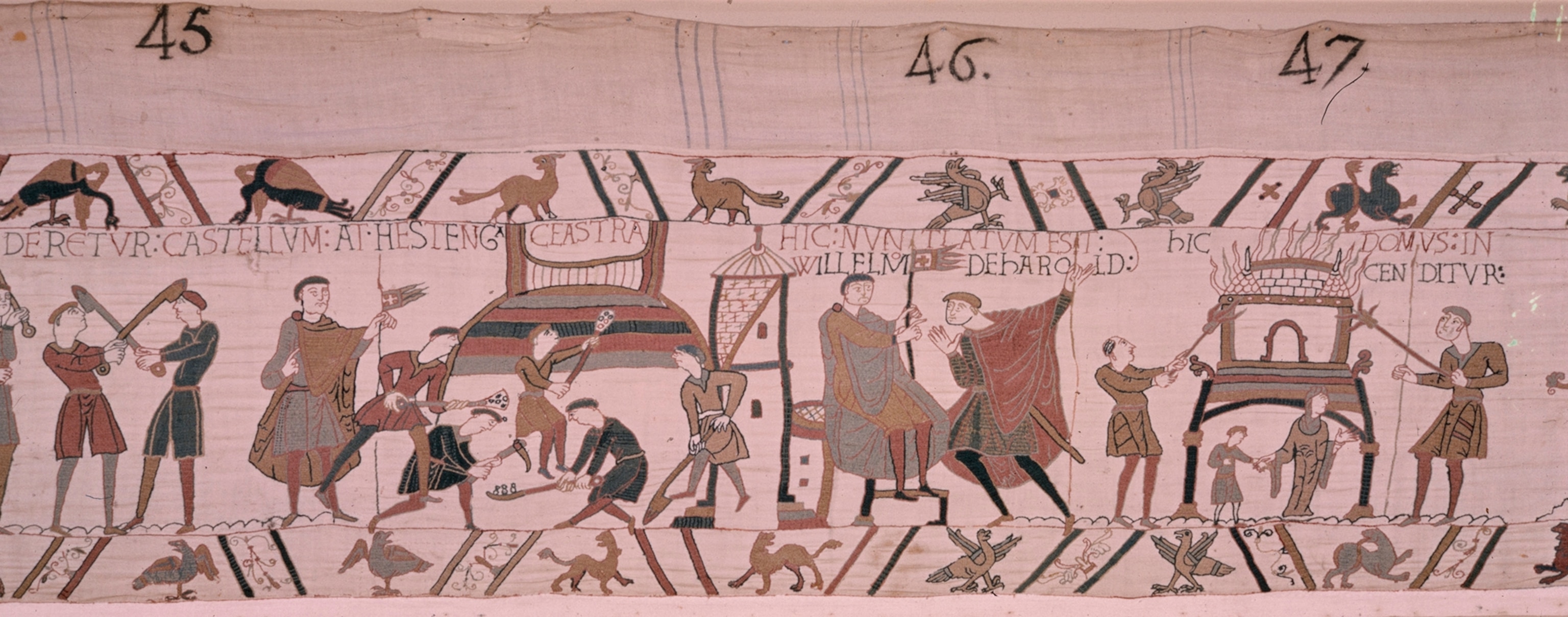 A scene from the tapestry in which William burns a house.