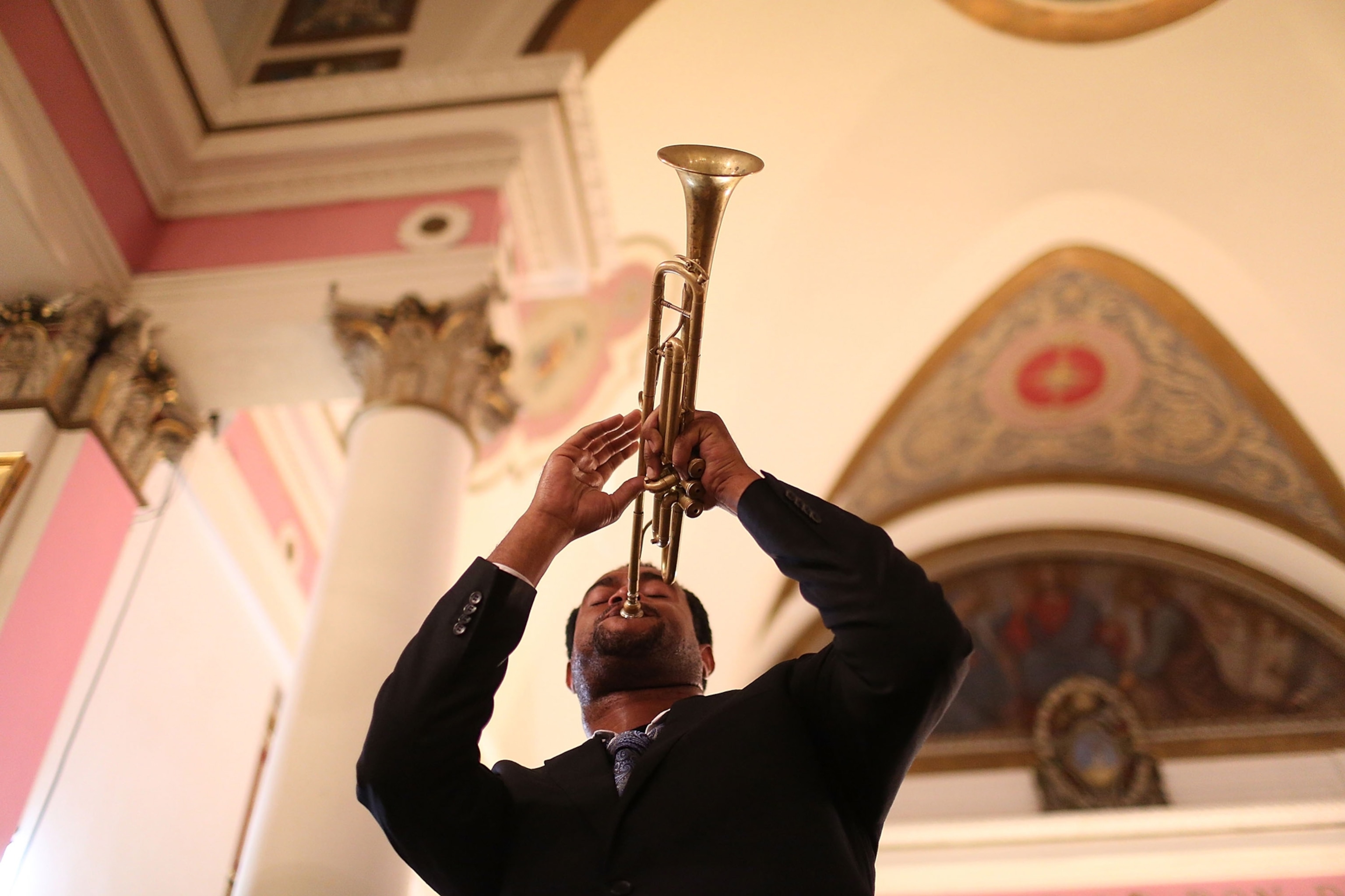 A trumpet player playing their trumpet