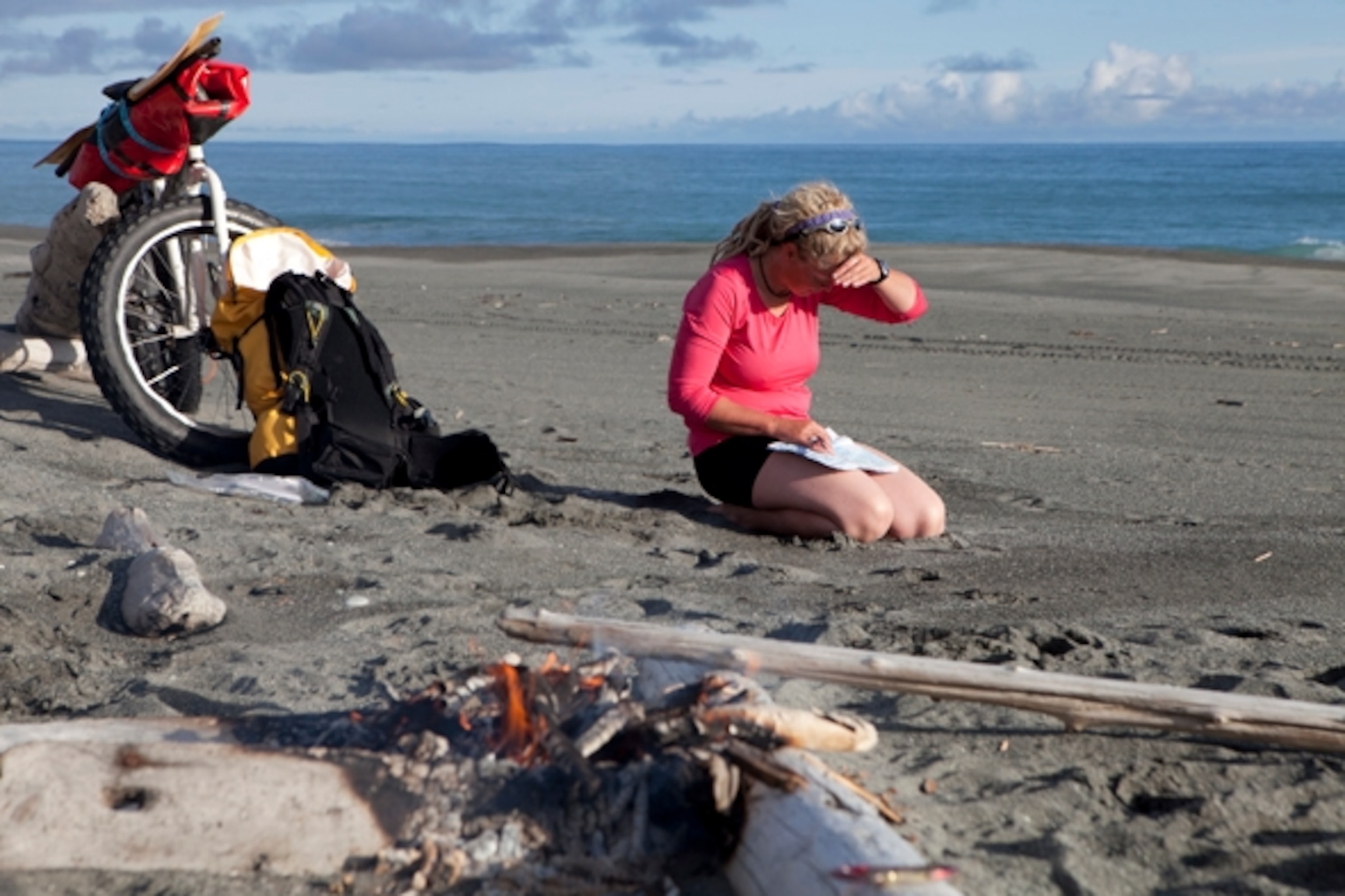 Iris takes a moment to look over our maps to find our location and gauge our progress; Photograph by Cameron Lawson