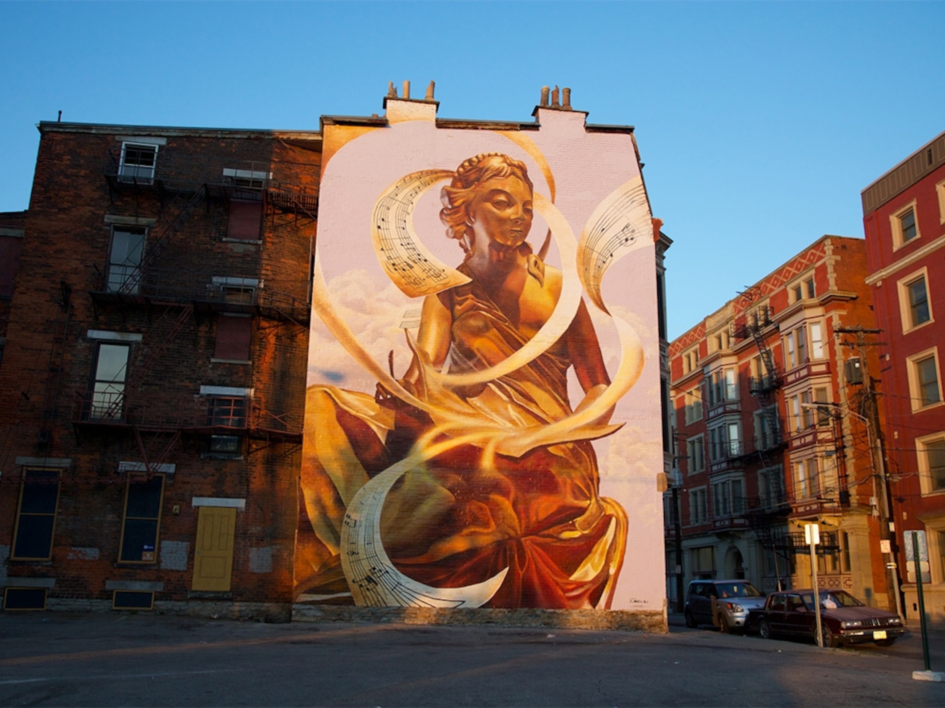 a mural on the side of a brick building in Cincinnati, Ohio