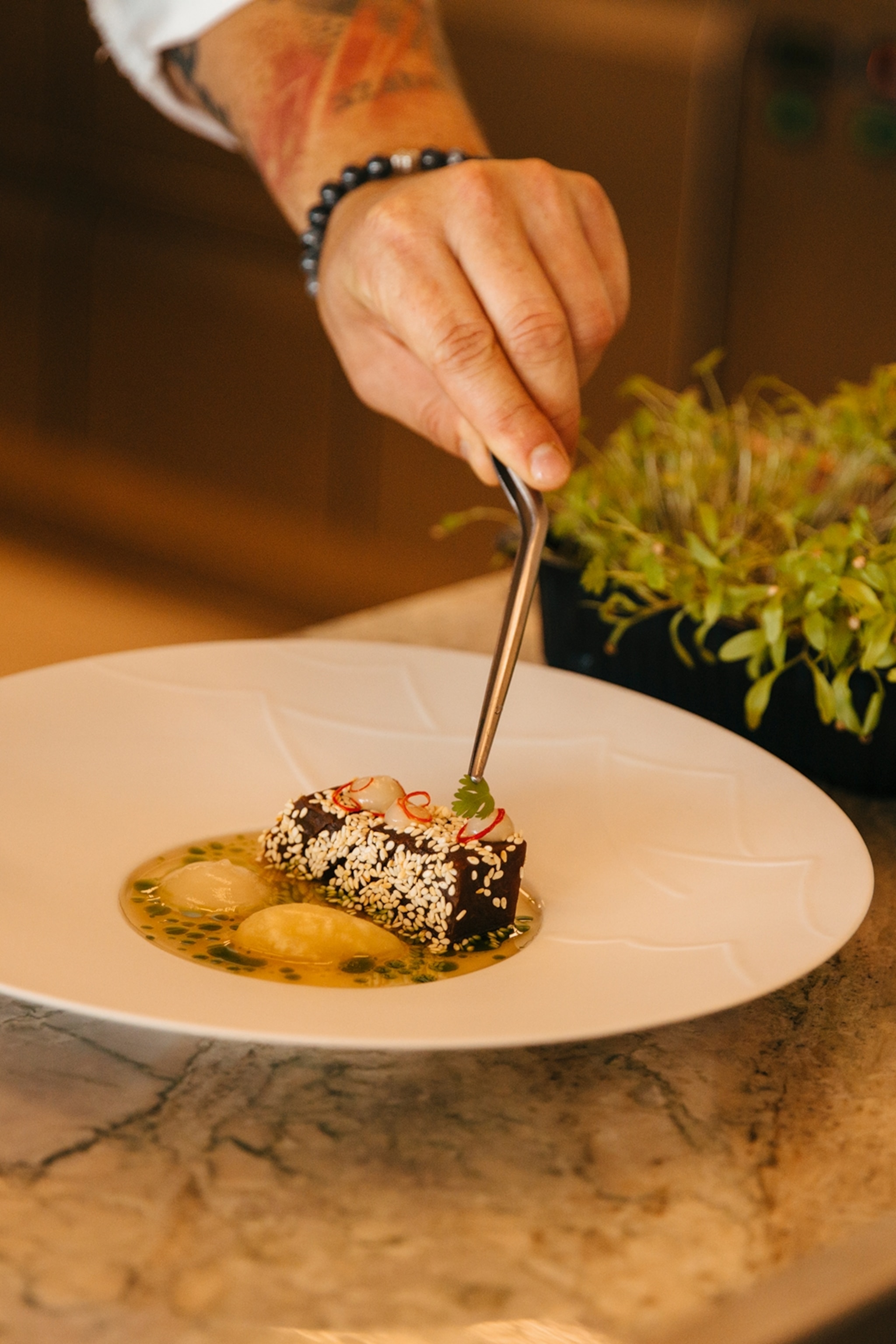 Máté Gerák, the chef at Sauska, serving a dish.
