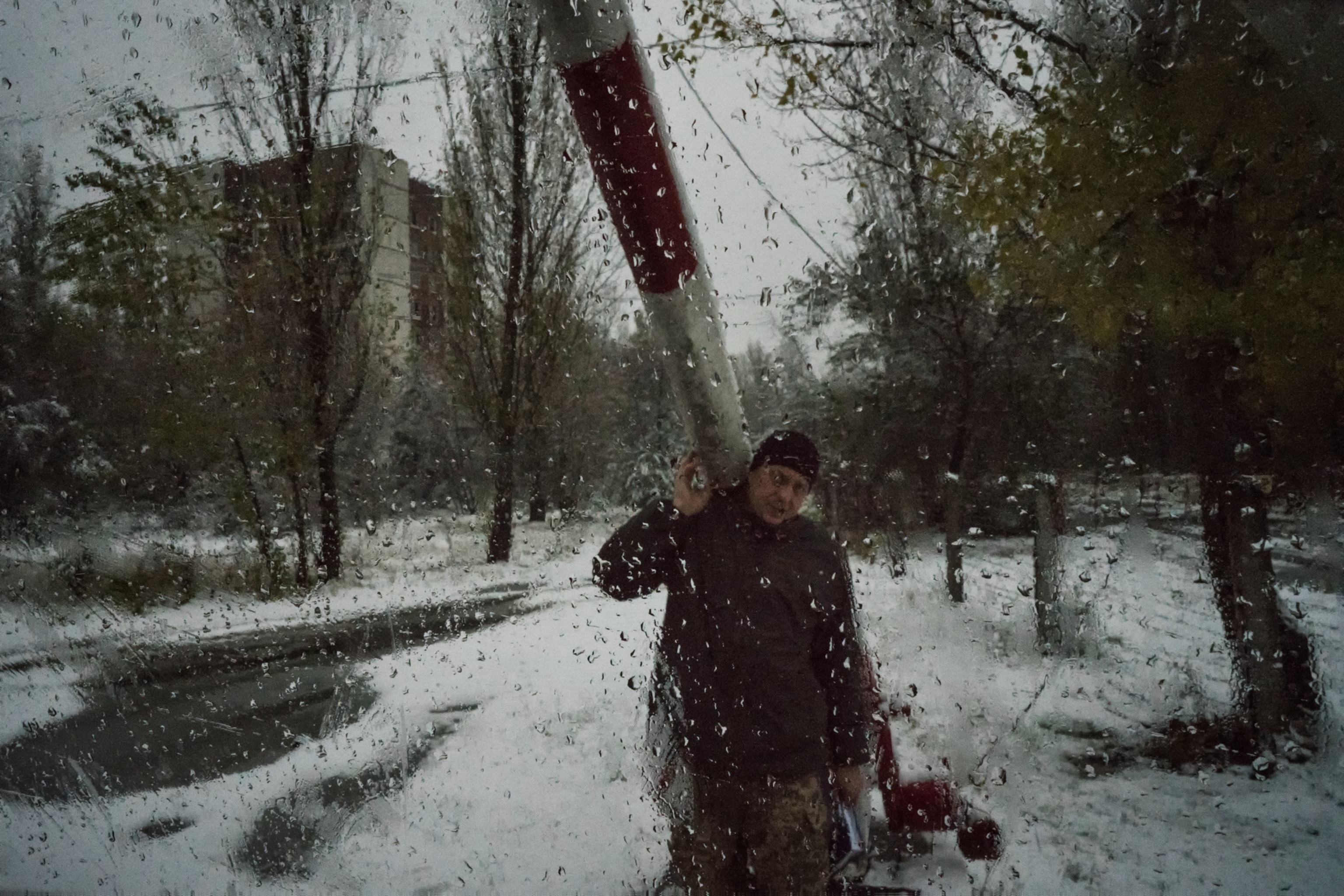 The guardian of the city of Pripyat as he raises the bar to let our van enter in Pripyat.