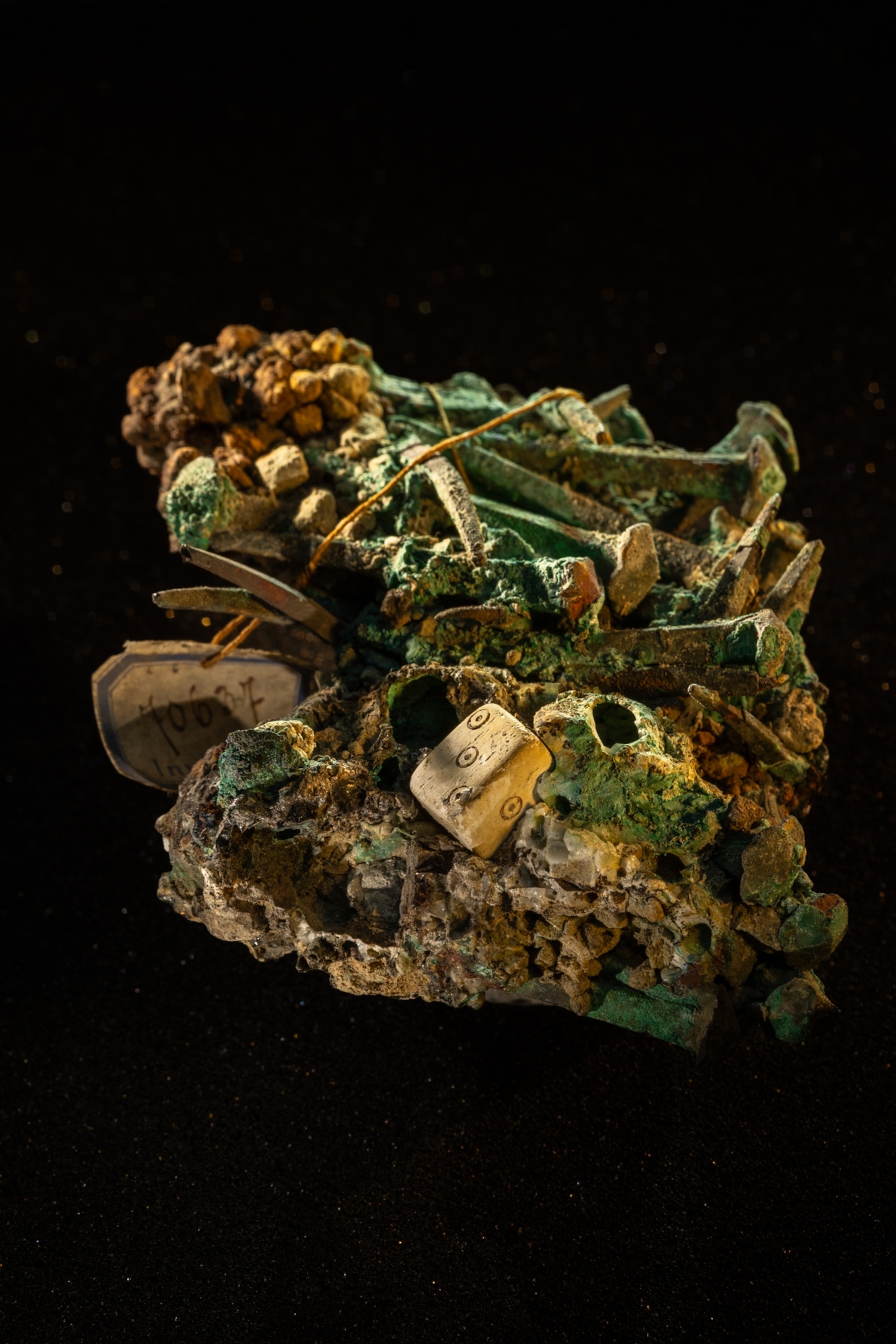A conglomerate of artifacts including old dice and nails