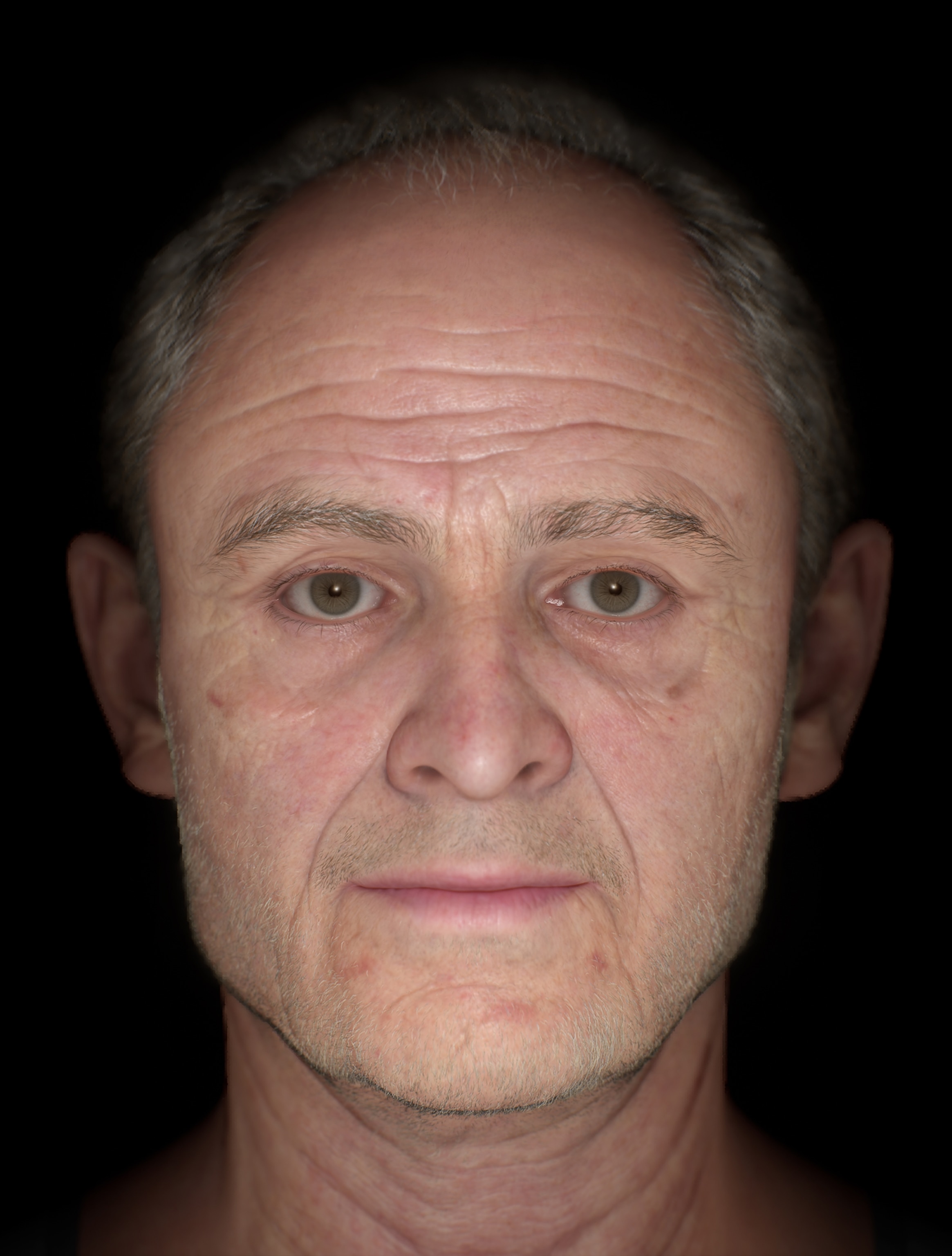 A close-up of an aging man with short gray hair and stubble.