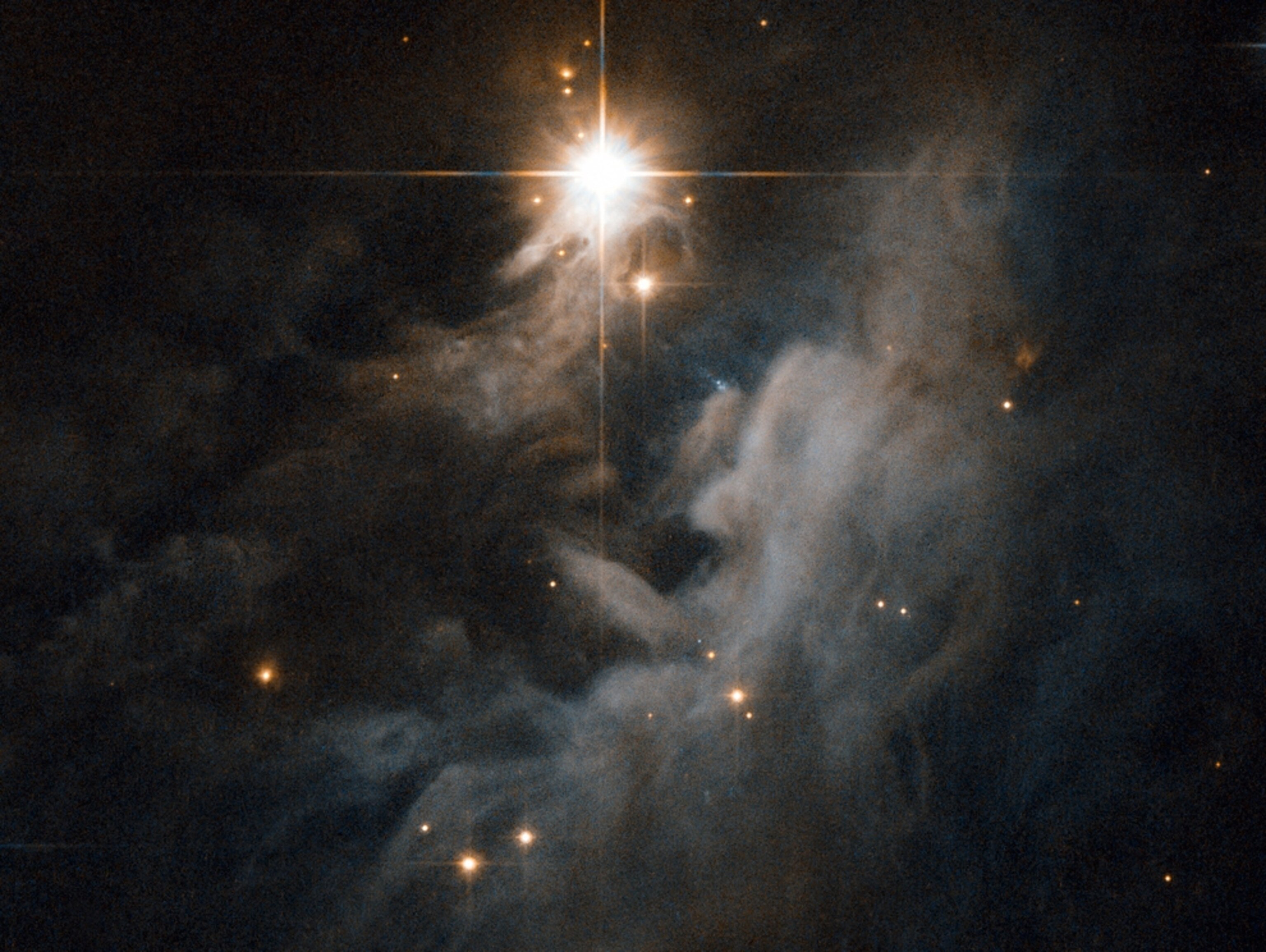 Nebula picture: light from a young star reflects off a cloud of dust and gas
