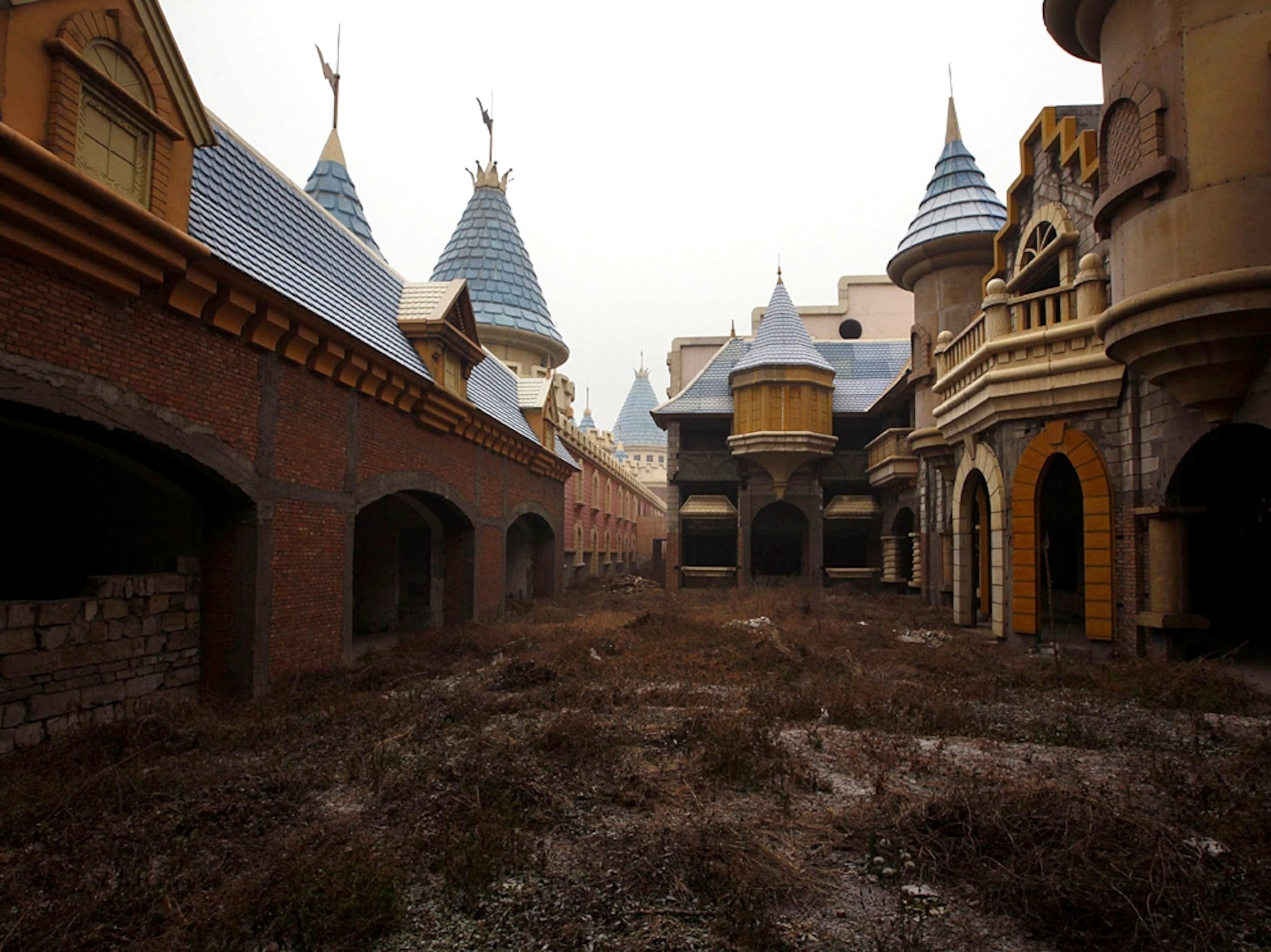China fake Disneyland picture: a group of unfinished buildings, for a gallery on Wonderland, an abandoned project to build an amusement park outside of Beijing, China
