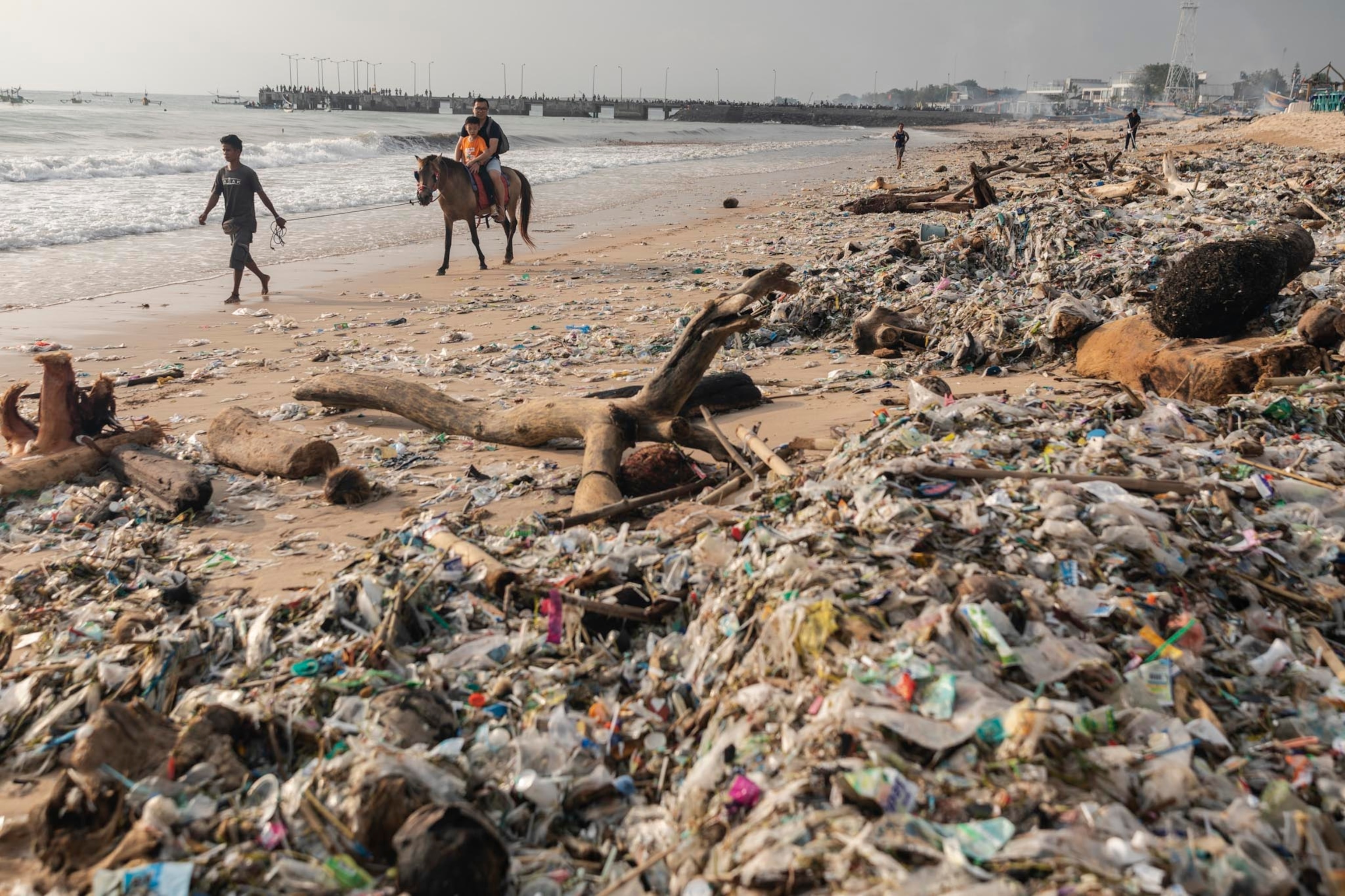 plastic waste washed up on the shores of Kedonganan Beach