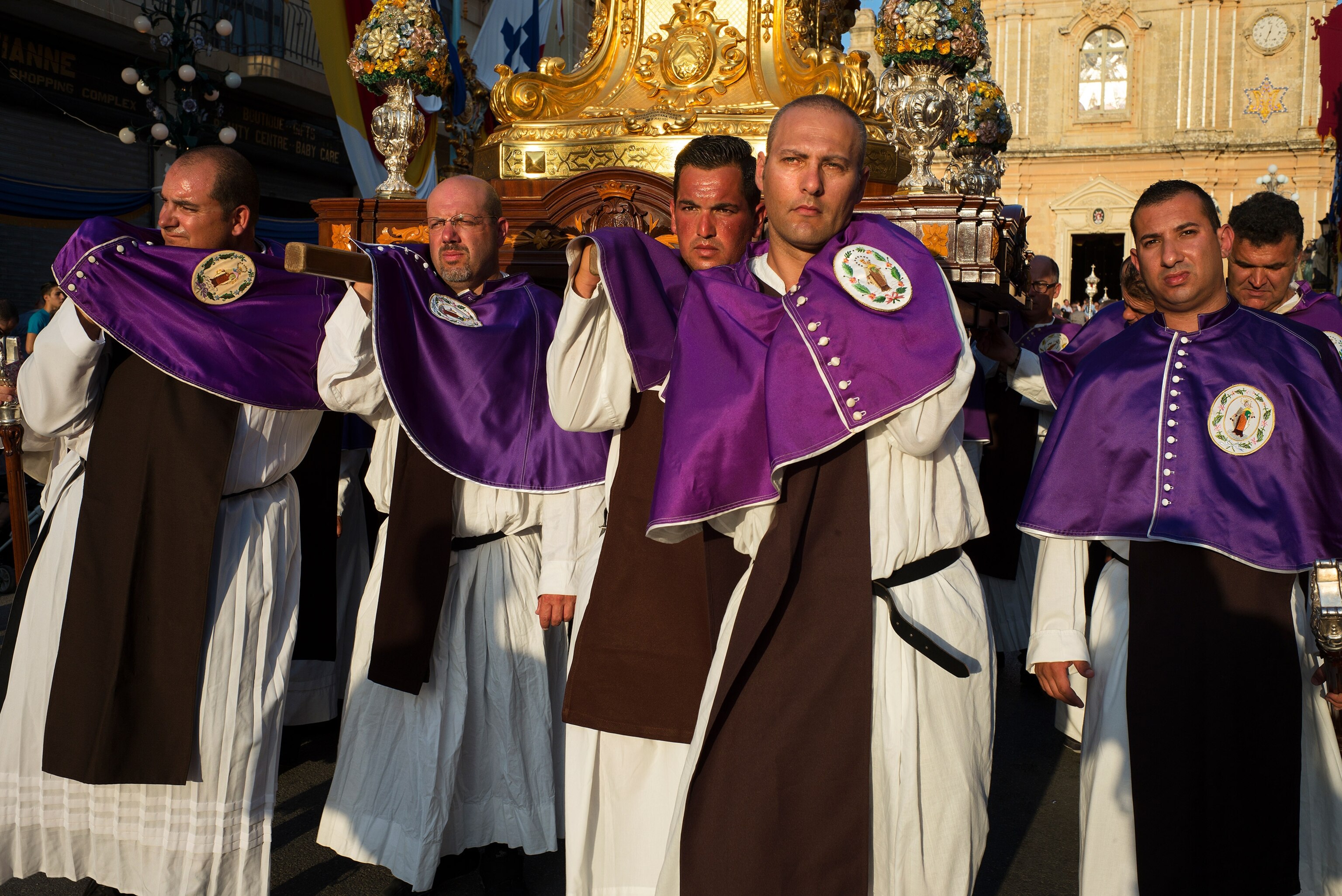 priests marching through the streets of Zurrieq, Malta