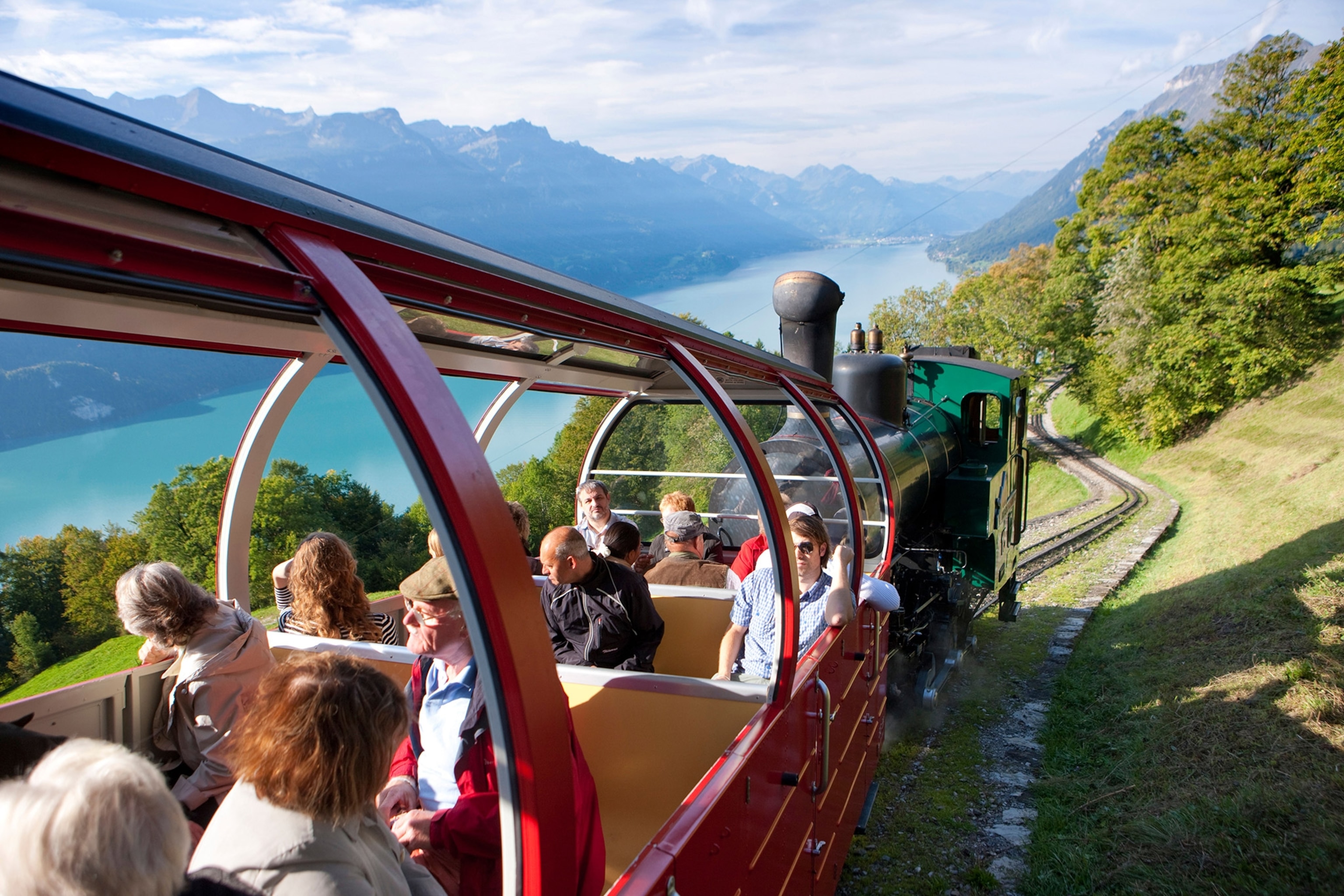 People on a train on a hill.