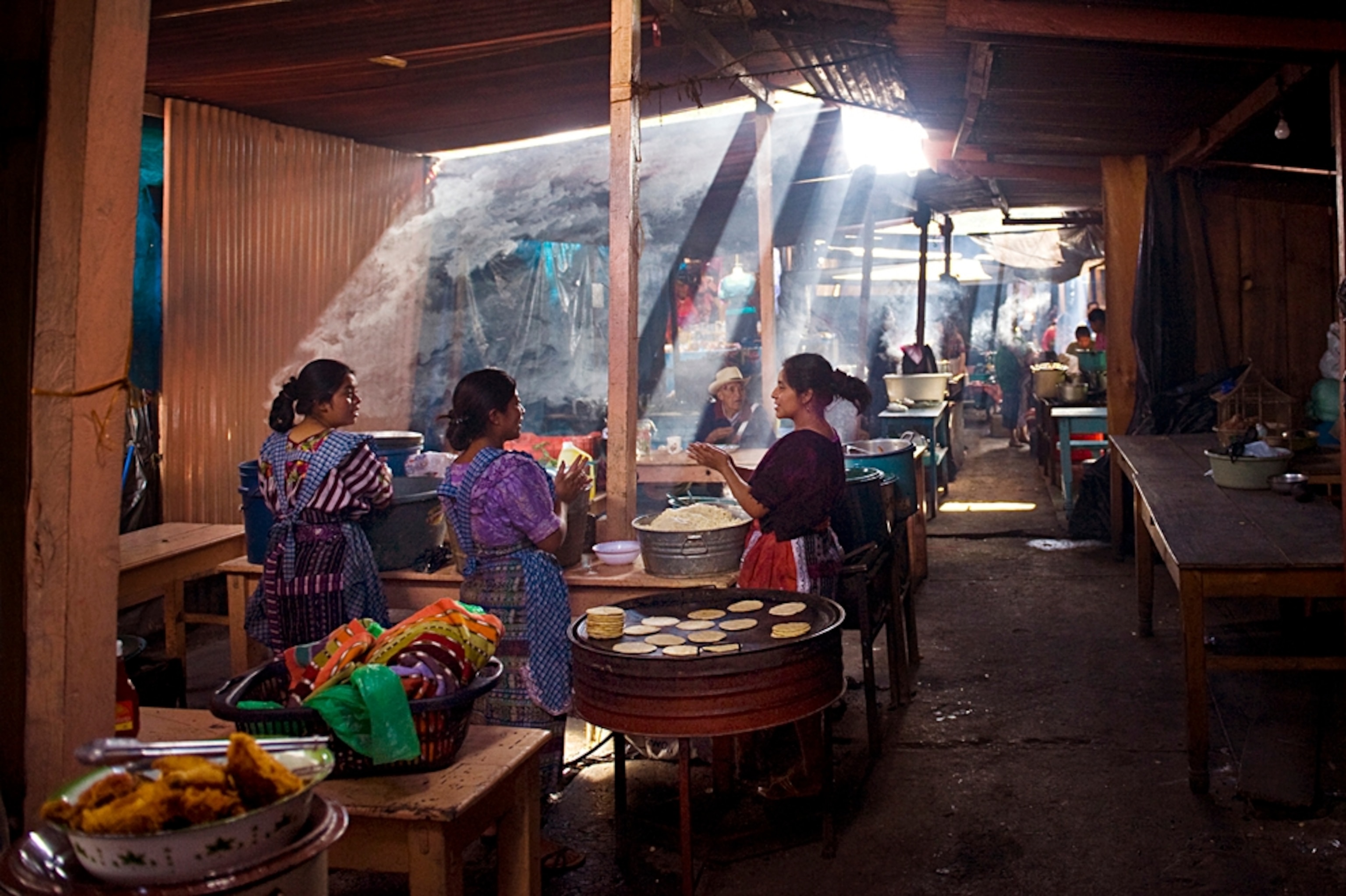 Maya women cooking at a market, Chichicastenango